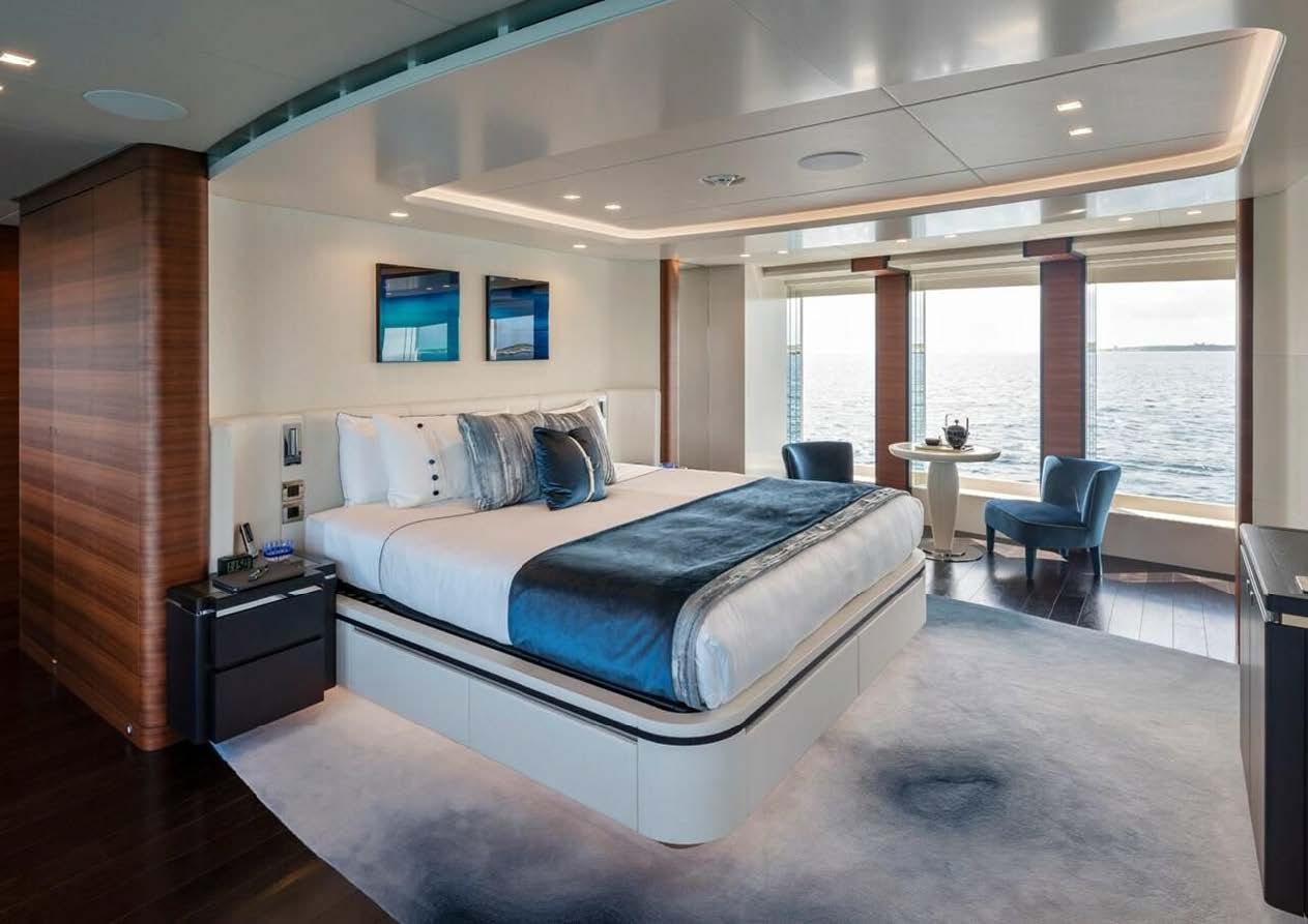 a large bed in a room aboard ELA Yacht for Sale
