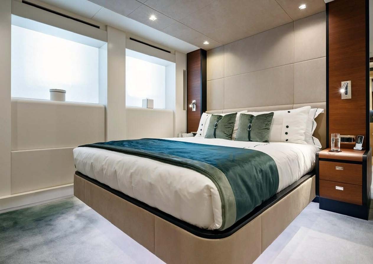 a bed in a room aboard ELA Yacht for Sale