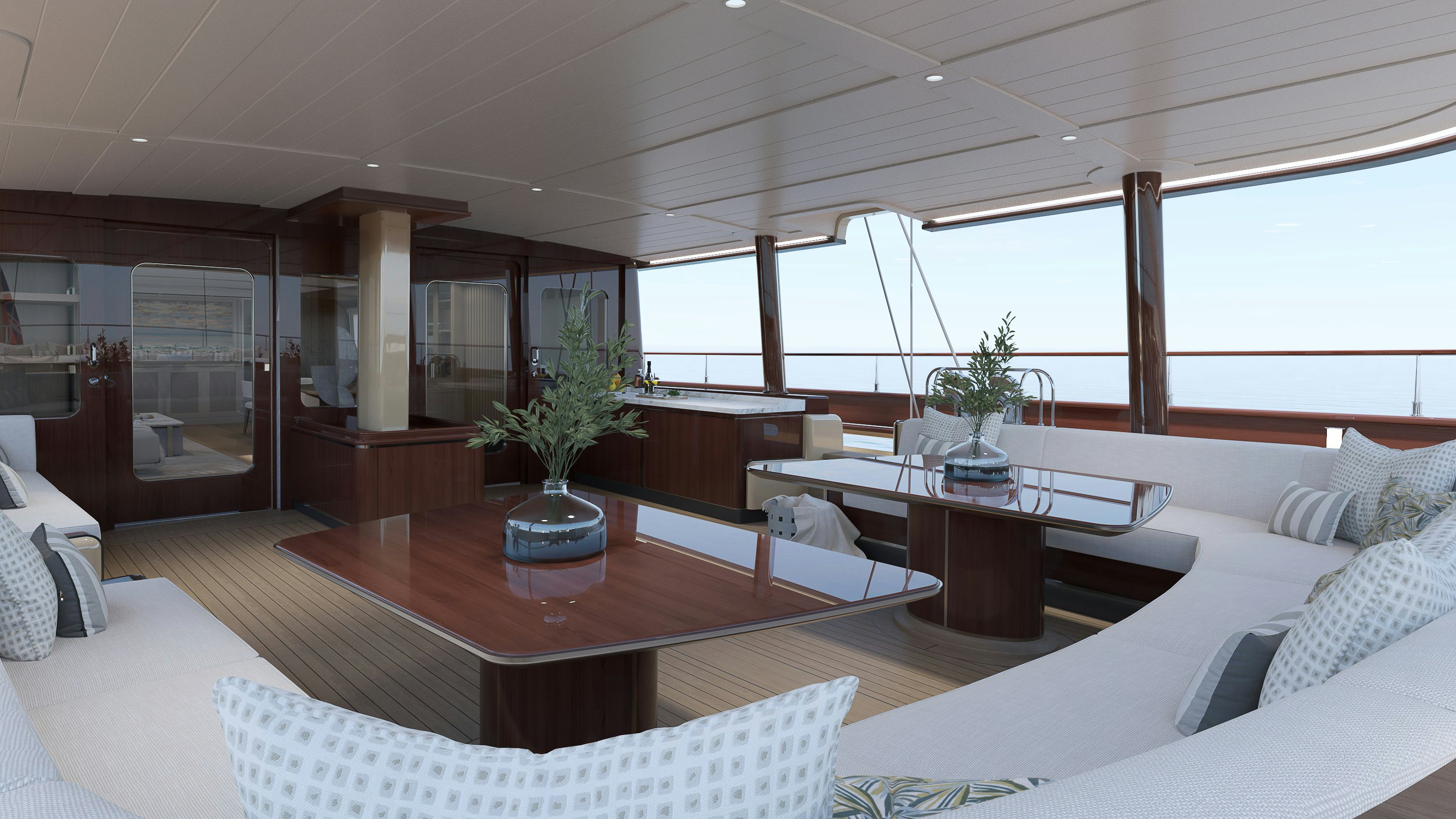 a living room with a table and couches aboard SIMENA Yacht for Sale