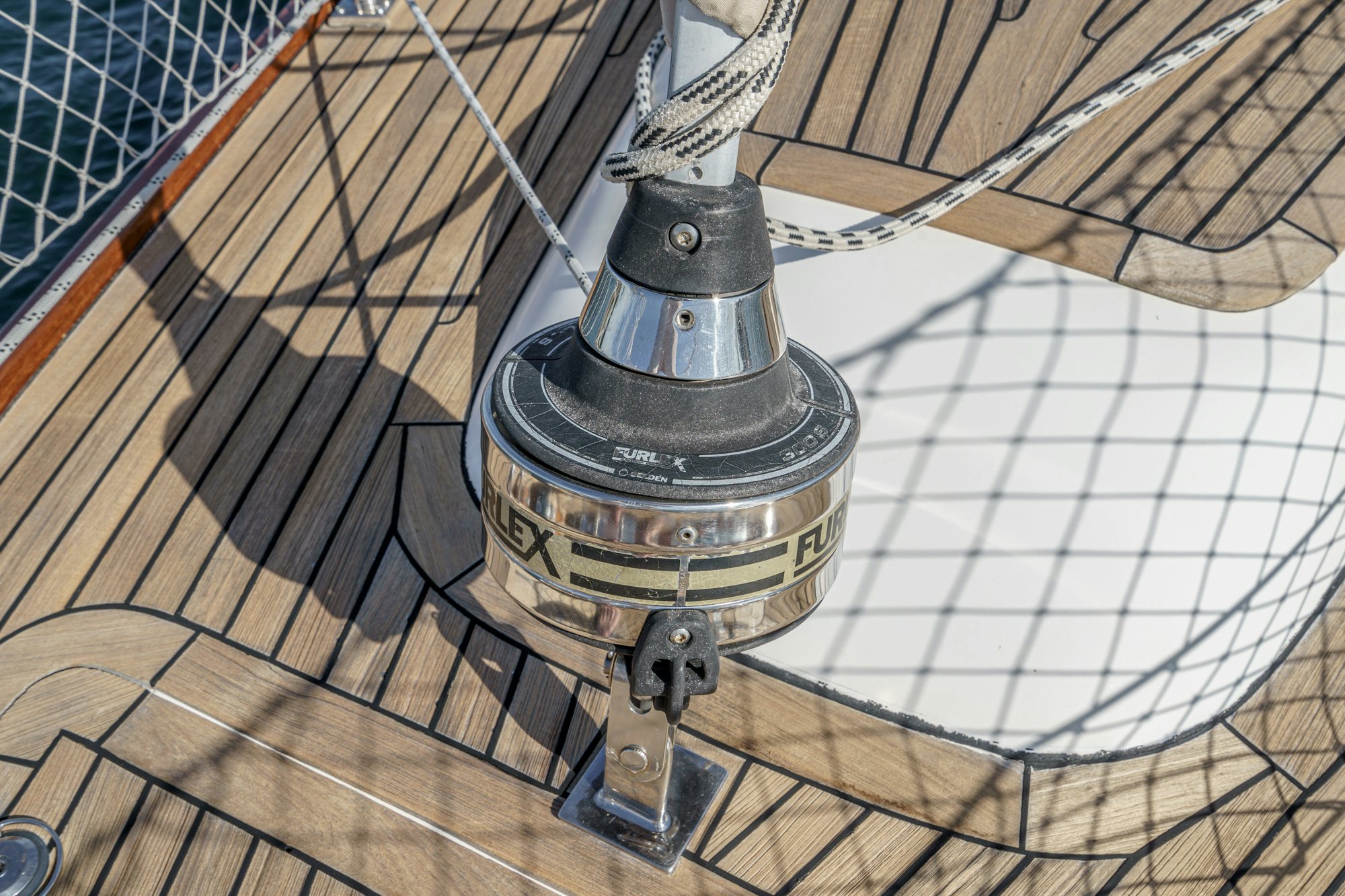 a metal object on a wooden surface aboard FEATHER Yacht for Sale