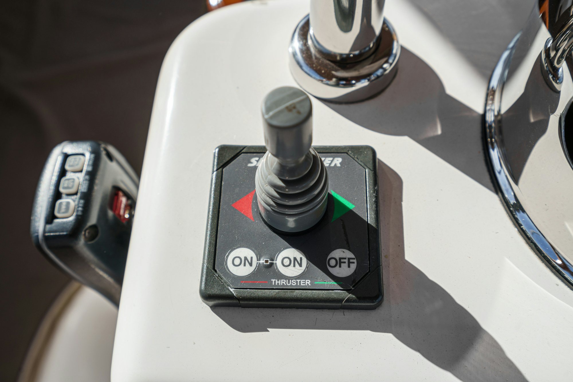 a close-up of a car key aboard FEATHER Yacht for Sale