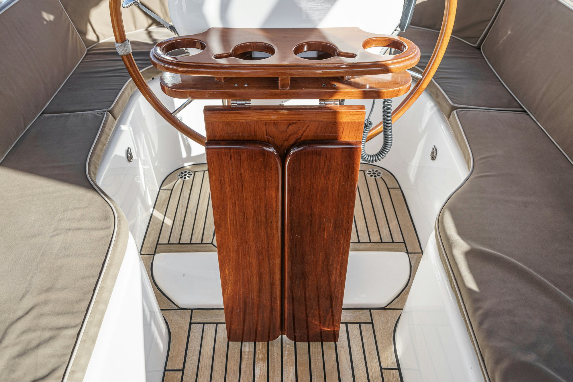 a wooden object on a white surface aboard FEATHER Yacht for Sale