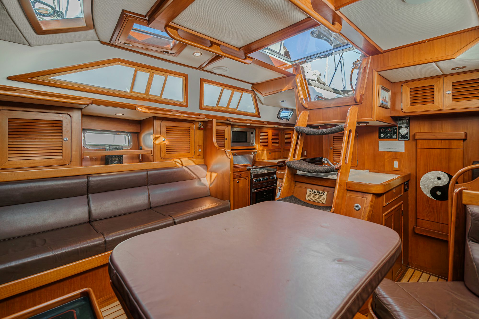 a room with a bed and a couch aboard FEATHER Yacht for Sale