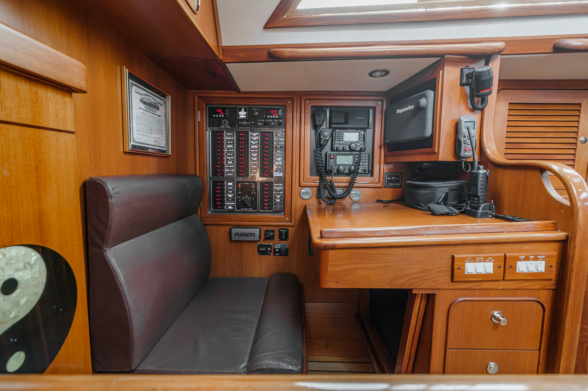 a room with a chair and a desk with a computer on it aboard FEATHER Yacht for Sale
