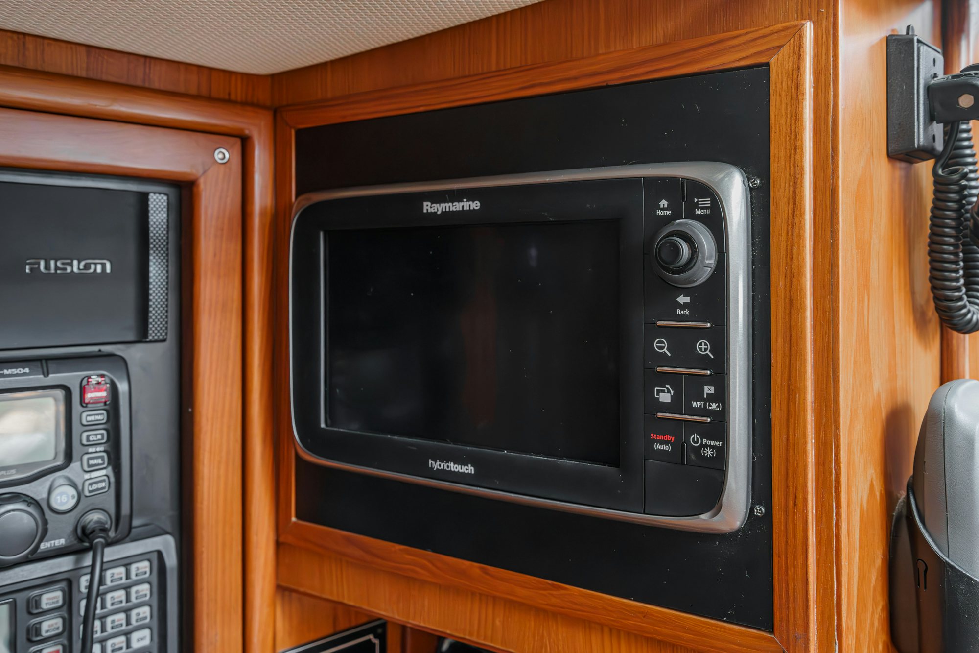 a microwave oven sits on top of a cabinet aboard FEATHER Yacht for Sale