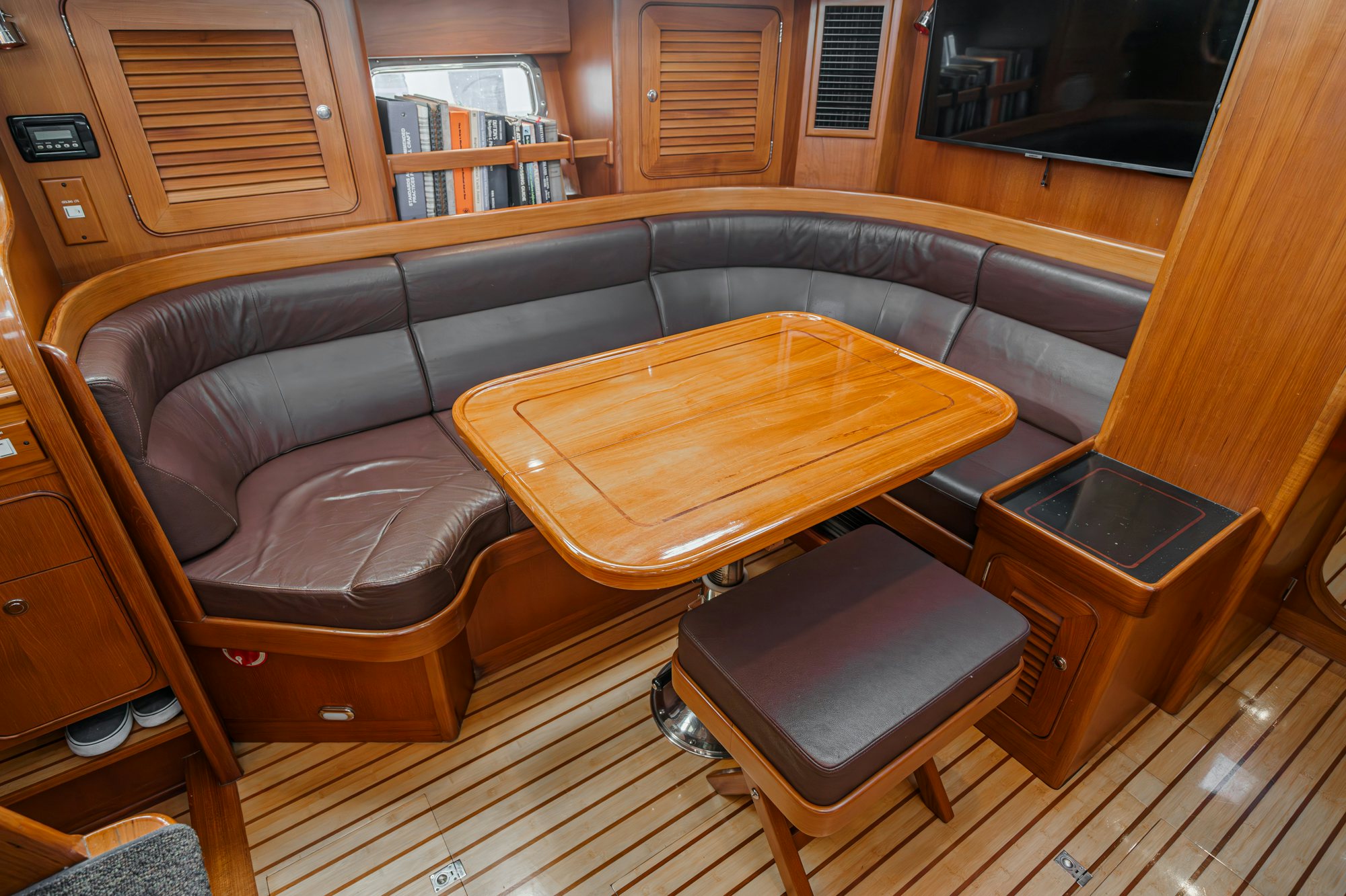 a leather couch in a room aboard FEATHER Yacht for Sale