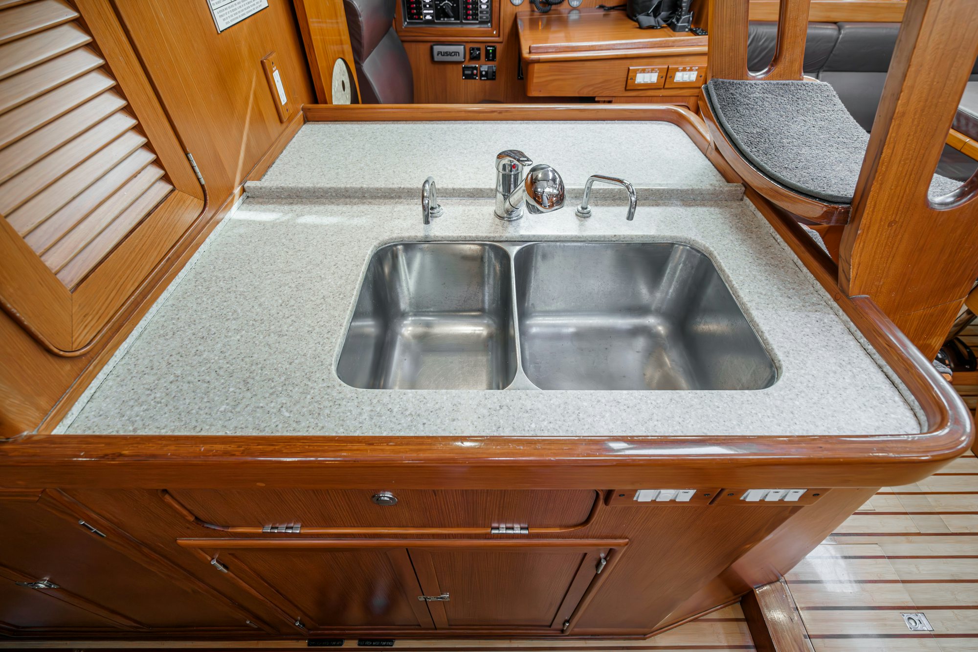 a kitchen with a sink and cabinets aboard FEATHER Yacht for Sale