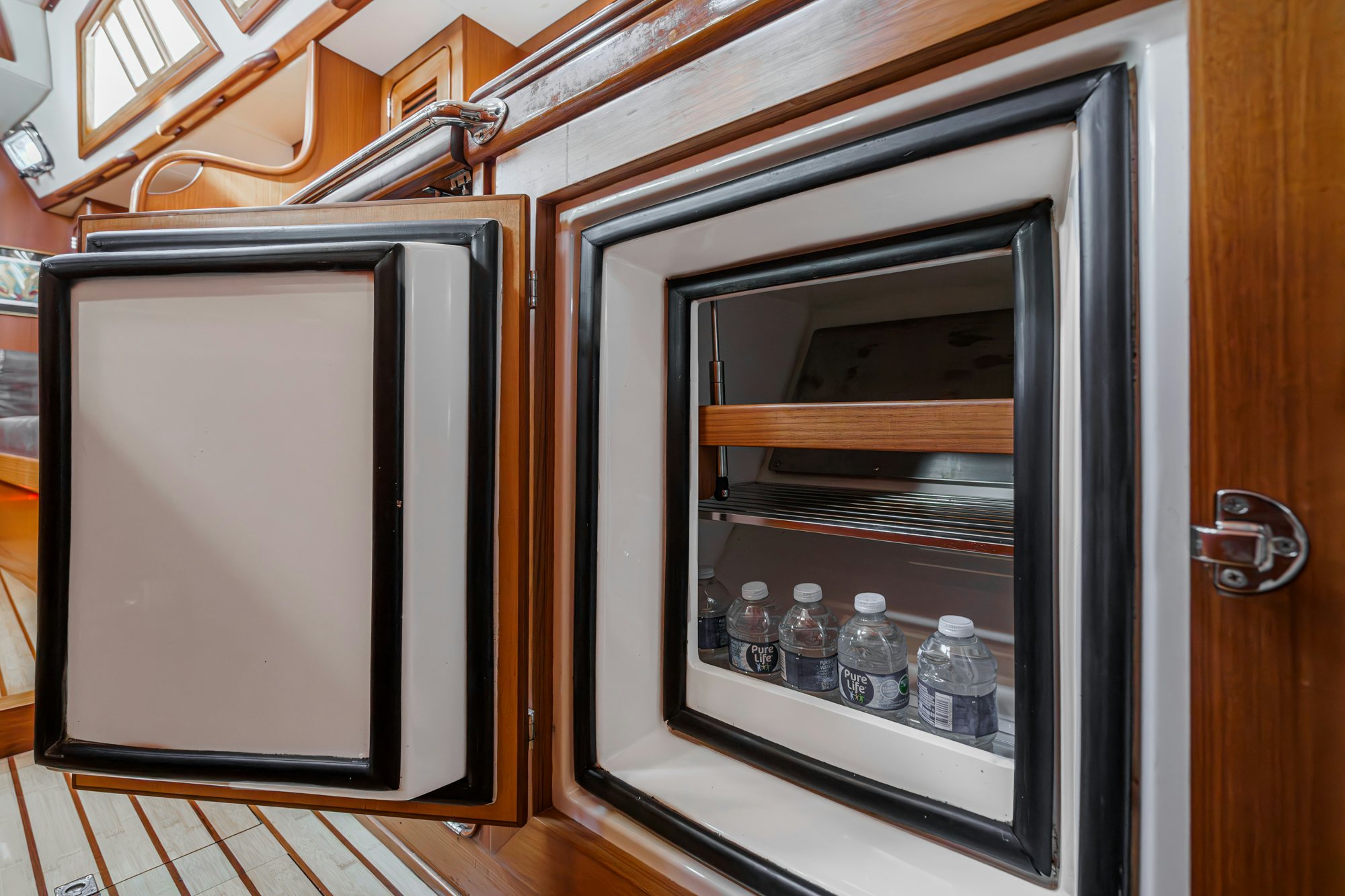 a silver oven with bottles in it aboard FEATHER Yacht for Sale