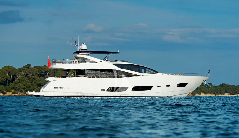 a white yacht in the water aboard OASIS Yacht for Charter