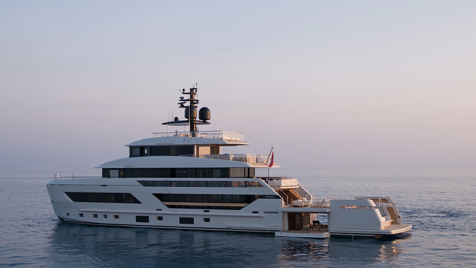 a large white boat in the water aboard LA LA LAND Yacht for Charter