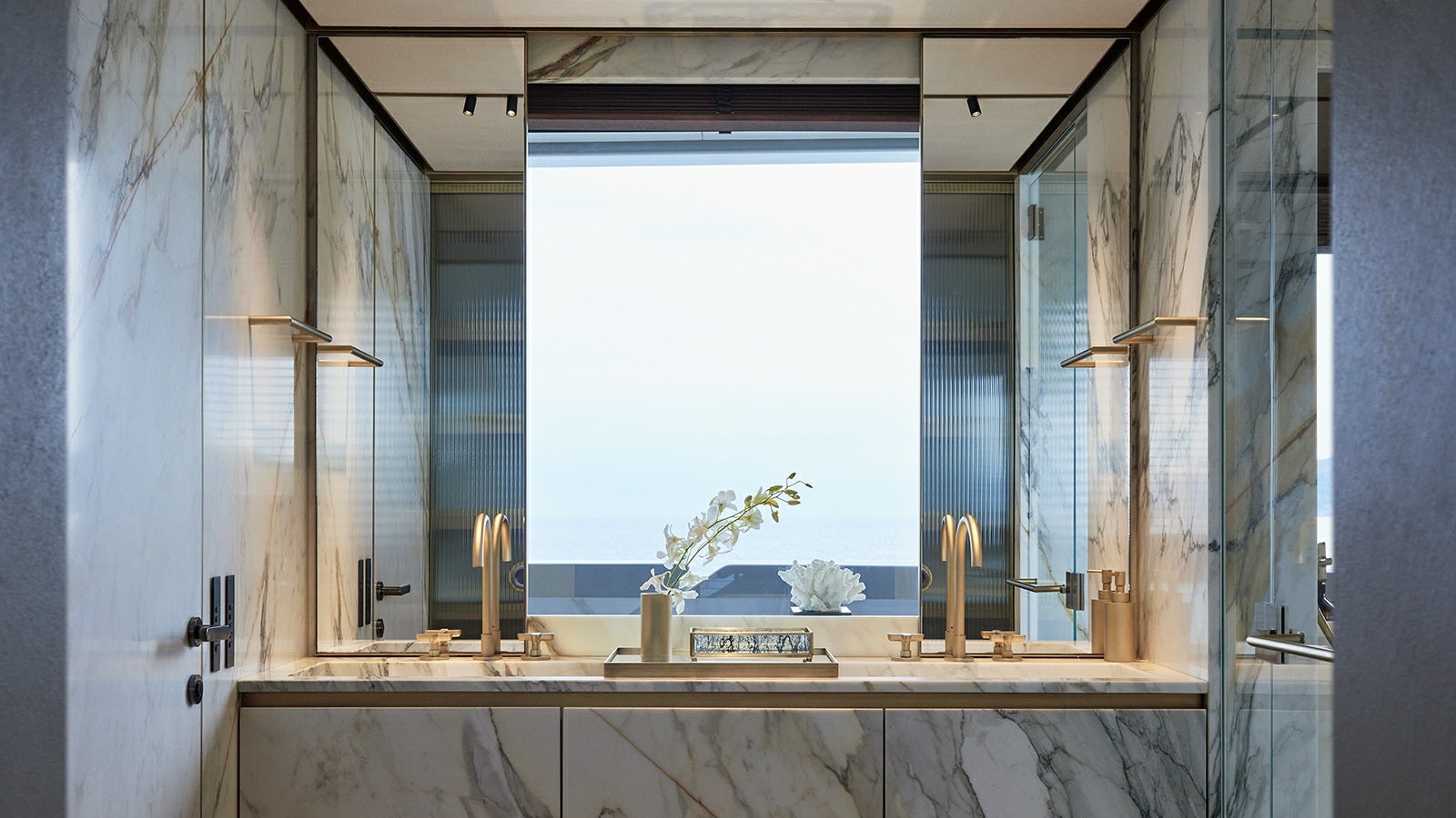 a counter with a window and a sink in a room aboard LA LA LAND Yacht for Charter