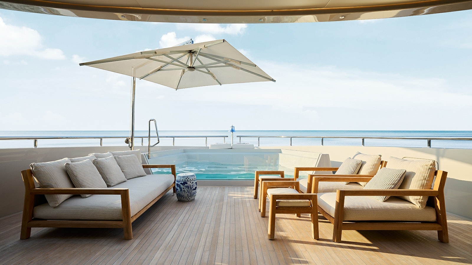 a lounge area with a large umbrella aboard LA LA LAND Yacht for Charter