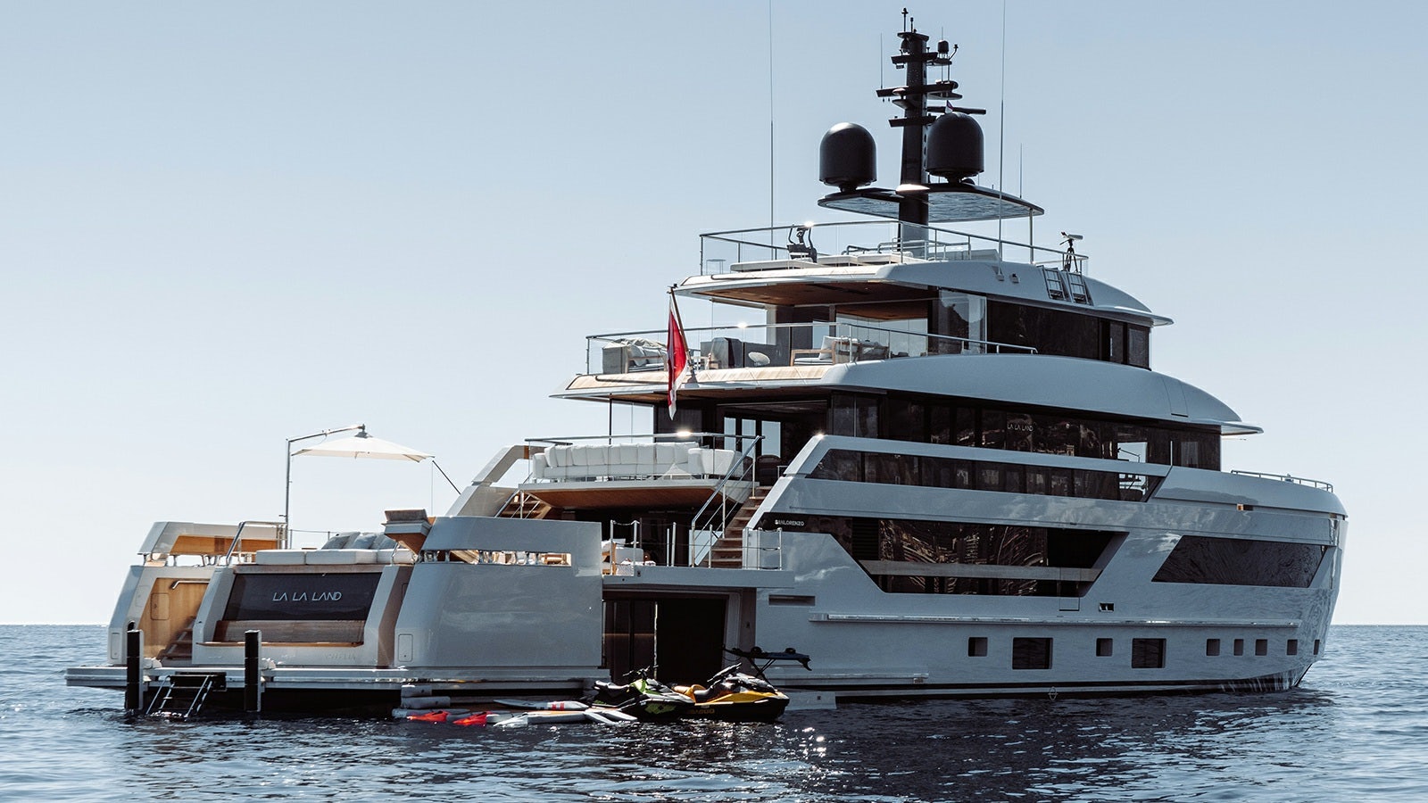 a large ship in the water with Thomas Point Shoal Light in the background aboard LA LA LAND Yacht for Charter