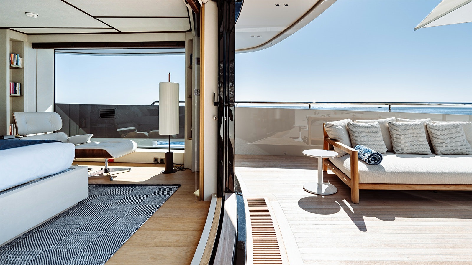 a living room with a large window aboard LA LA LAND Yacht for Charter