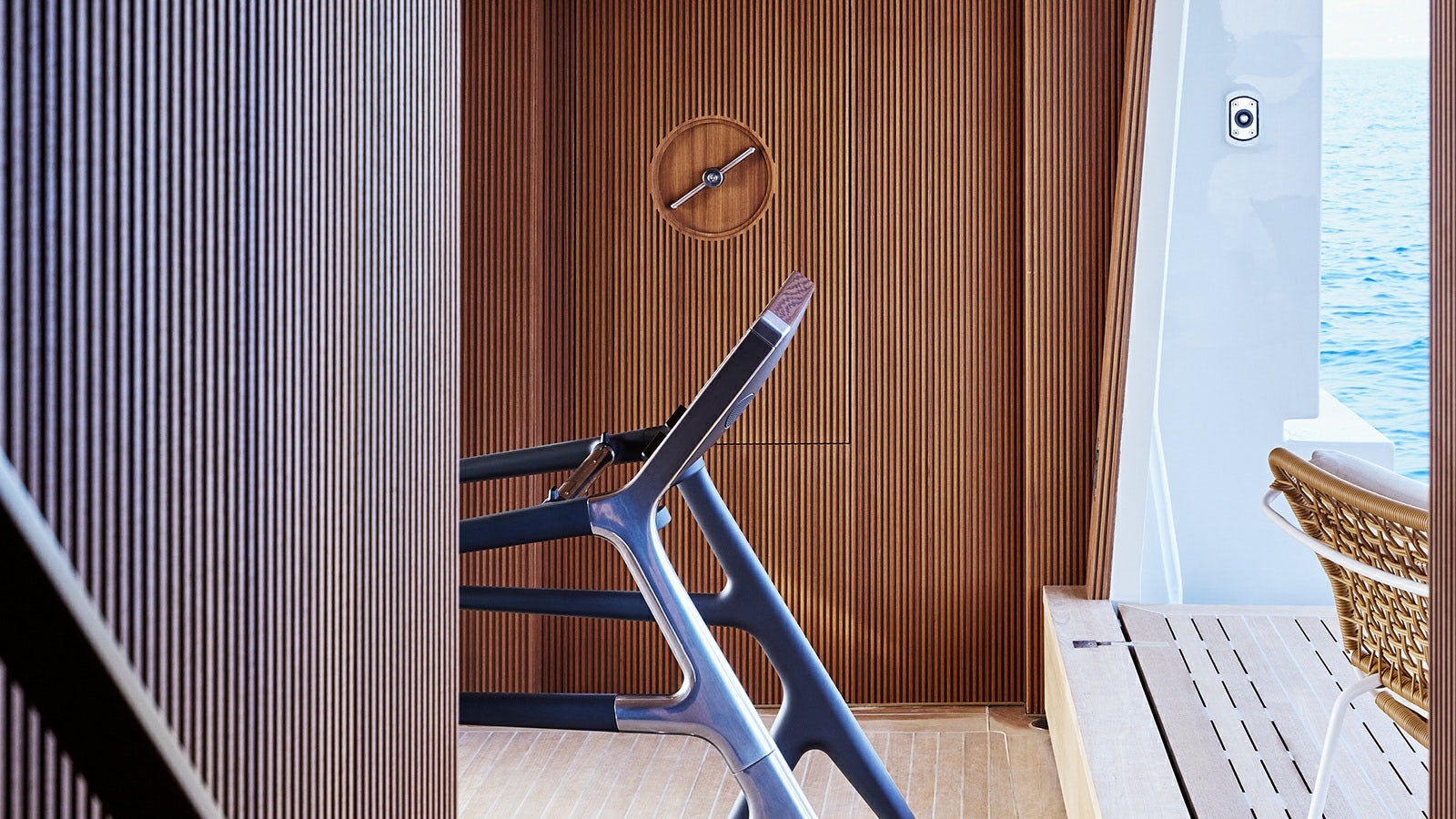 a blue and pink bicycle leaning against a wall aboard LA LA LAND Yacht for Charter
