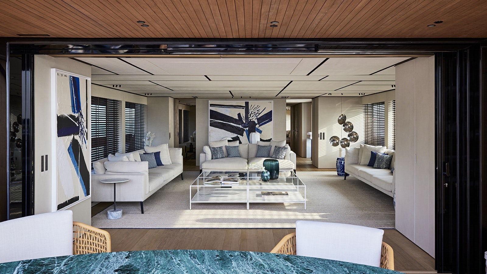 a living room with a white couch aboard LA LA LAND Yacht for Charter