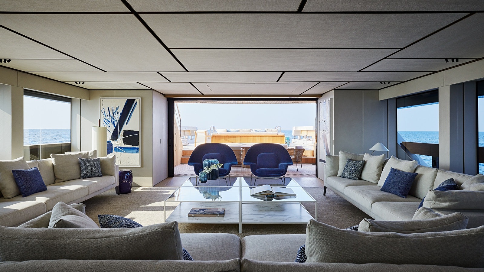a living room with a large window aboard LA LA LAND Yacht for Charter