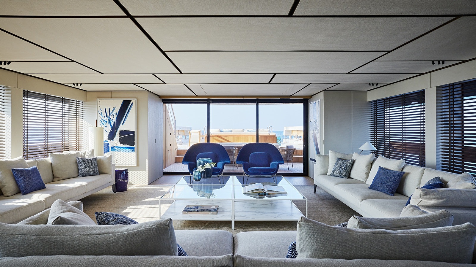 a living room with a large glass window aboard LA LA LAND Yacht for Charter