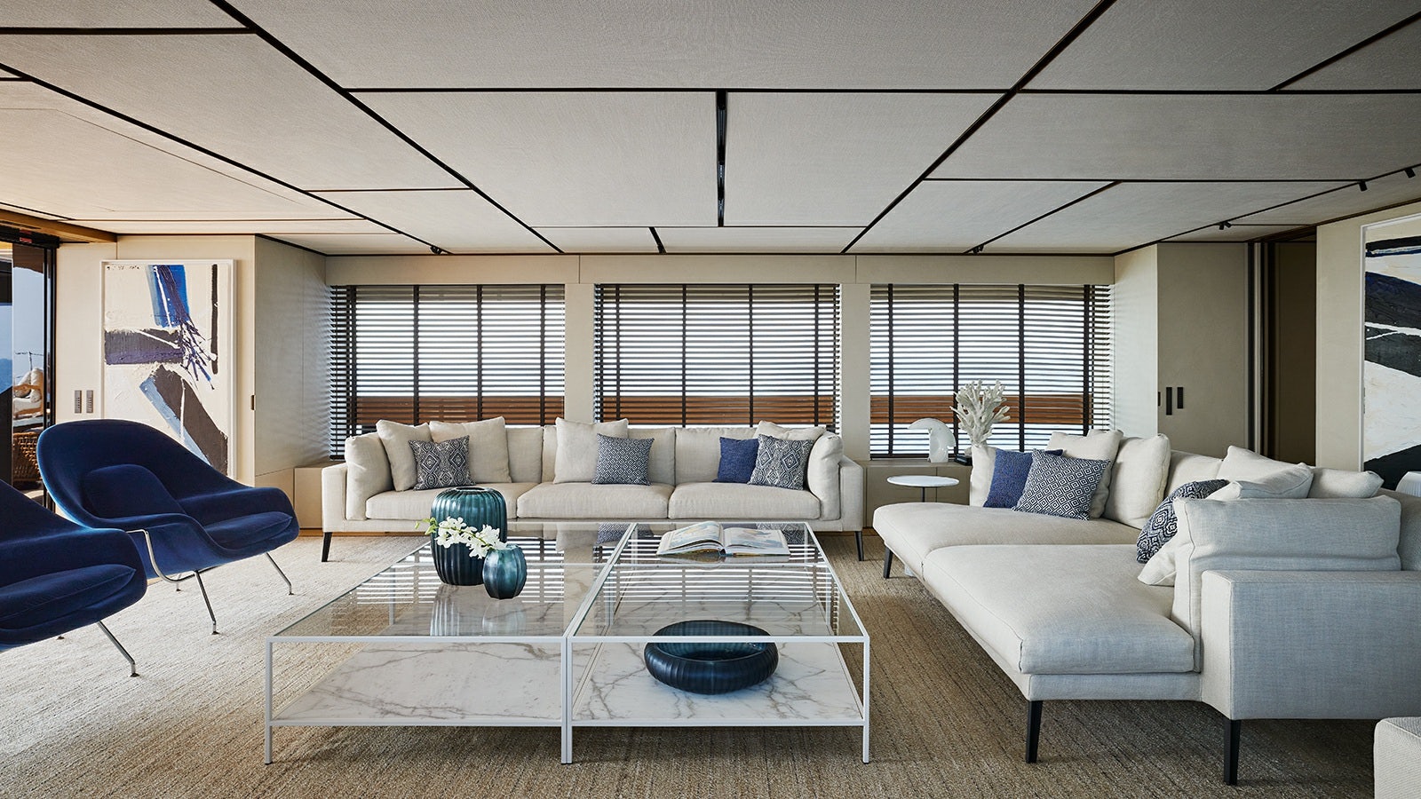 a living room with a couch and a table aboard LA LA LAND Yacht for Charter