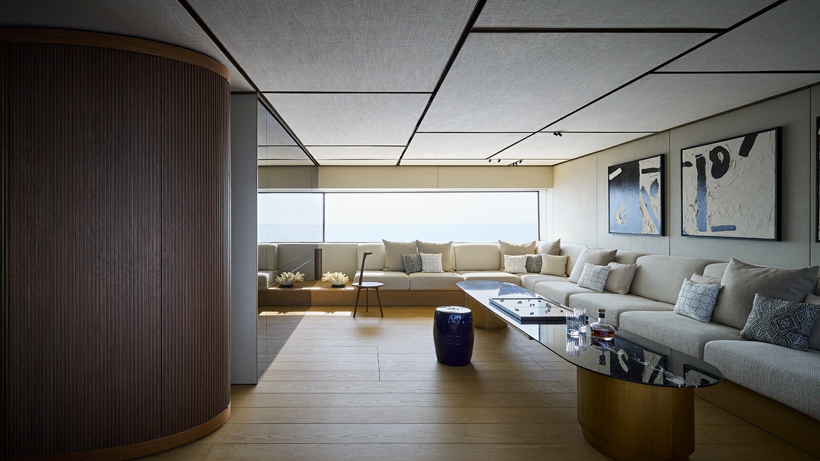 a living room with a couch and a coffee table aboard LA LA LAND Yacht for Charter