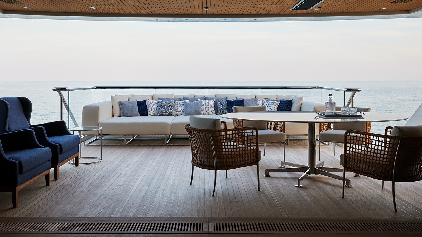 a room with a table chairs and a couch aboard LA LA LAND Yacht for Charter