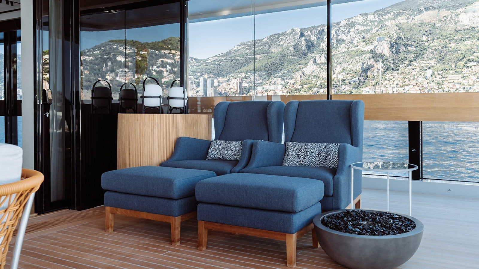 a living room with a blue couch aboard LA LA LAND Yacht for Charter