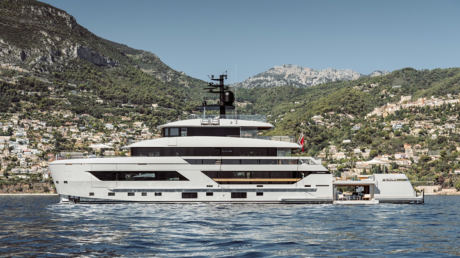 a large white yacht in the water aboard LA LA LAND Yacht for Charter