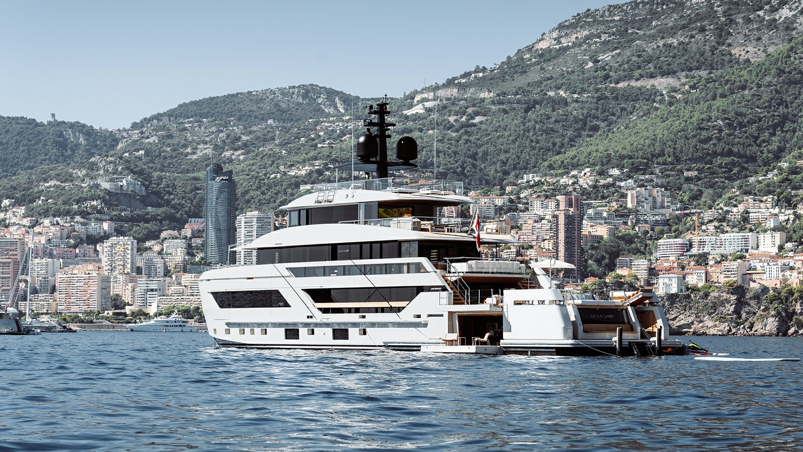 a boat on the water with Hydra in the background aboard LA LA LAND Yacht for Charter