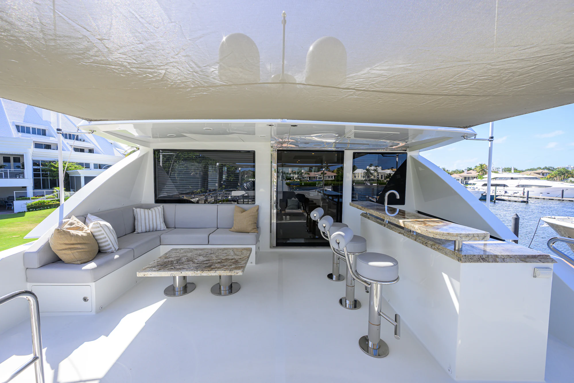a room with a couch and a table and chairs aboard CHINDON Yacht for Sale