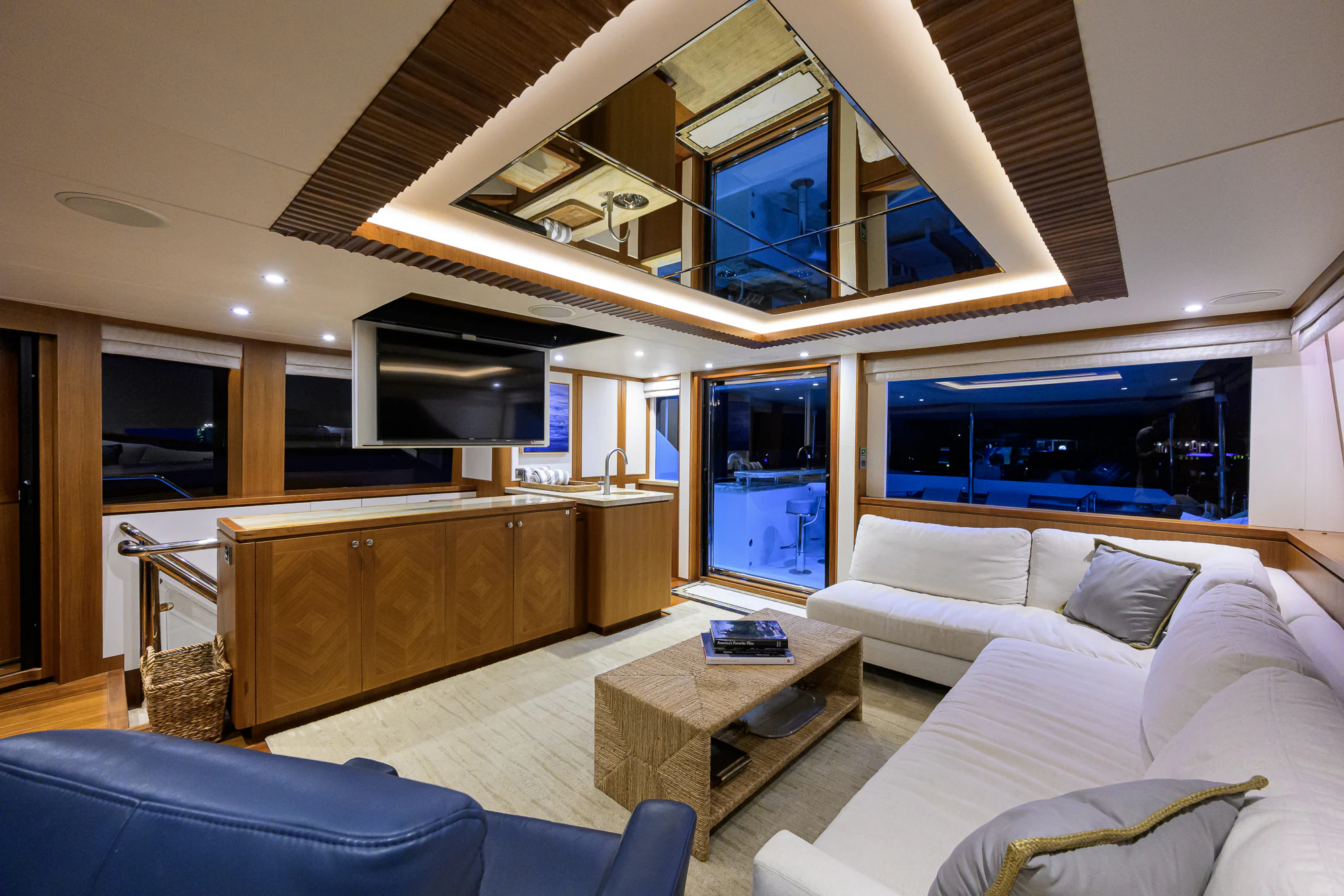 a living room with a large window aboard CHINDON Yacht for Sale