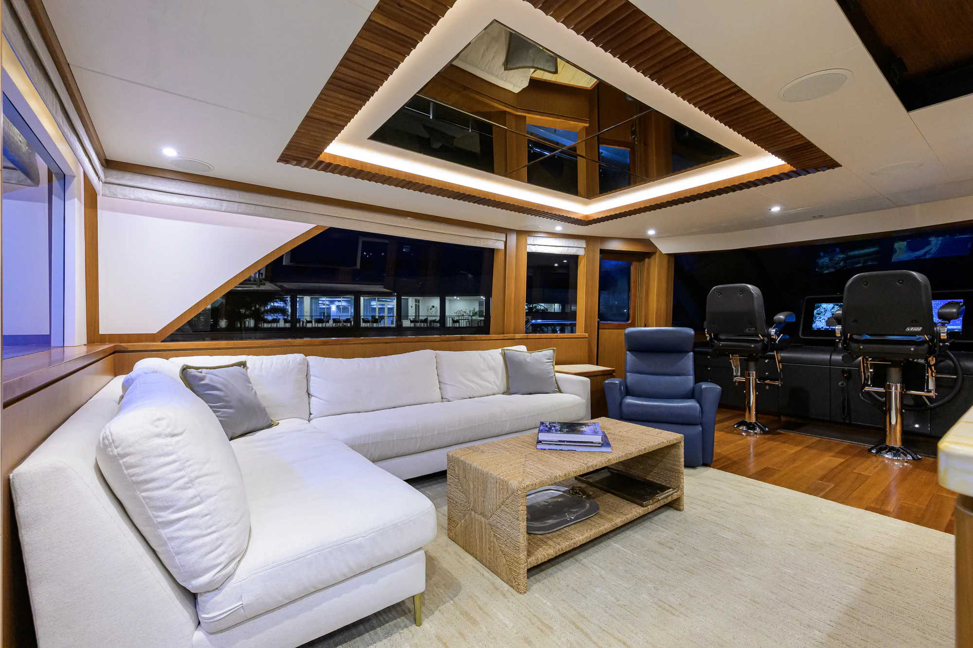 a living room with a couch and a table aboard CHINDON Yacht for Sale