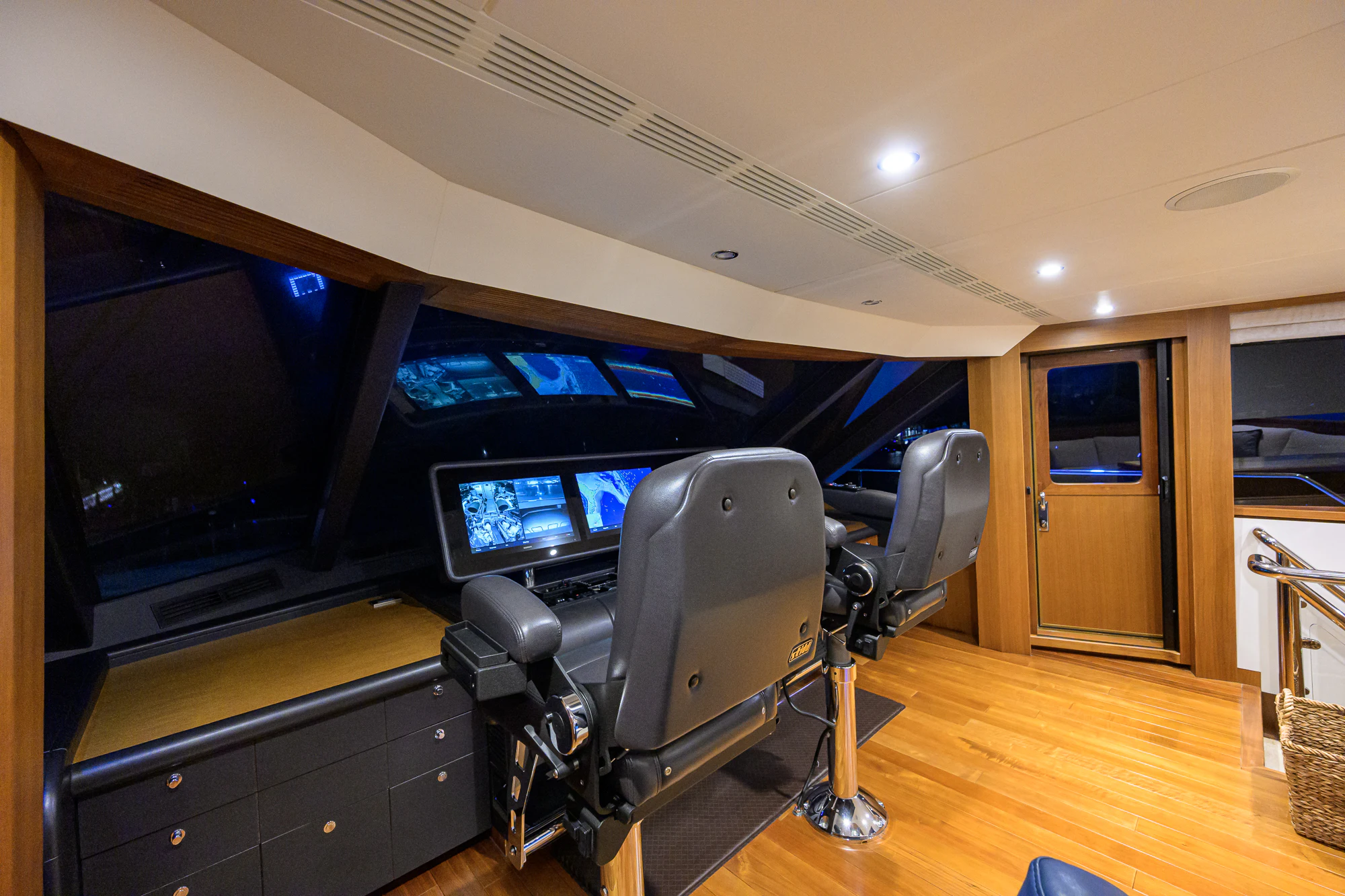 a room with a large tv and a chair aboard CHINDON Yacht for Sale