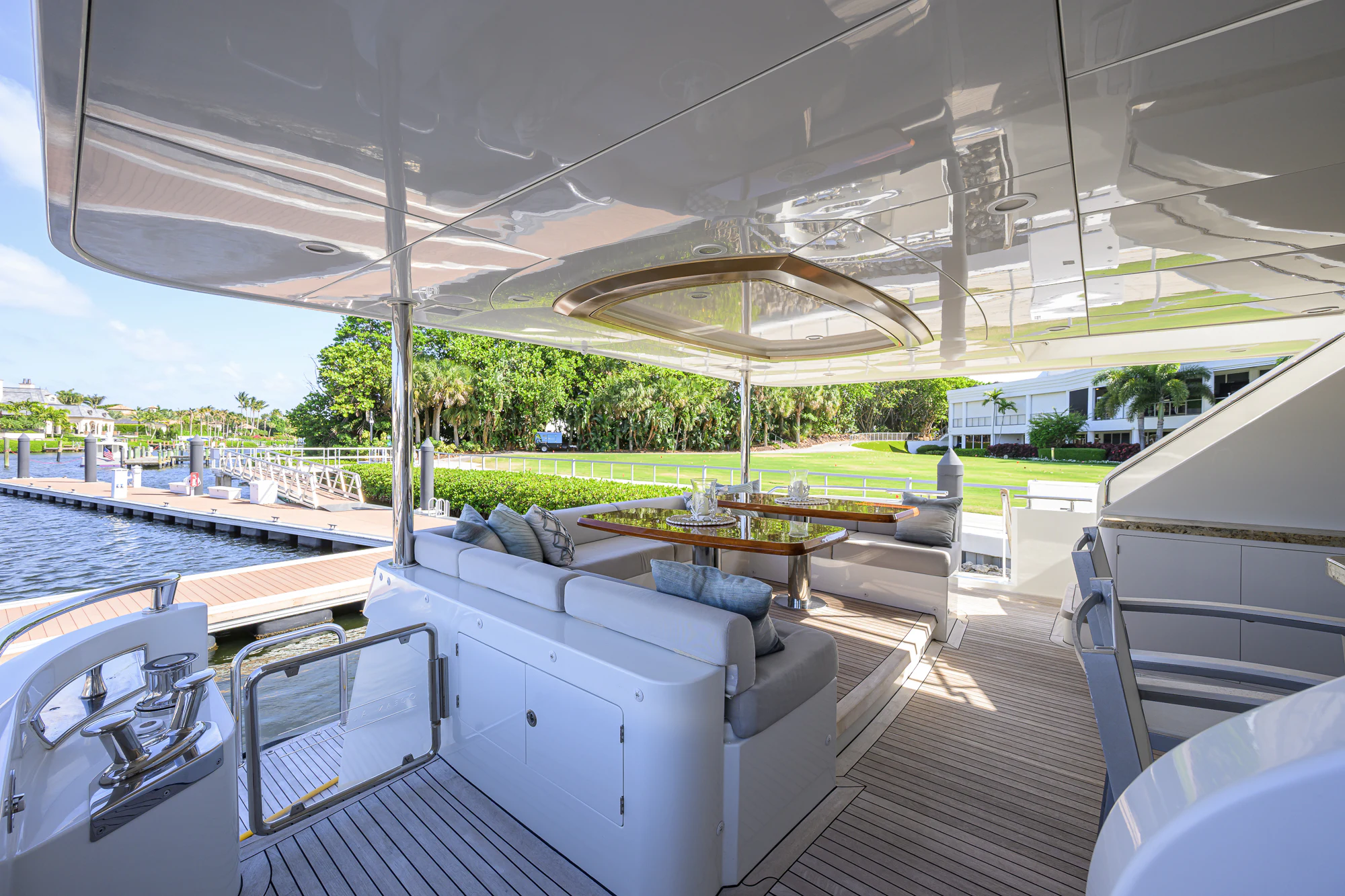 a deck with a table and chairs aboard CHINDON Yacht for Sale
