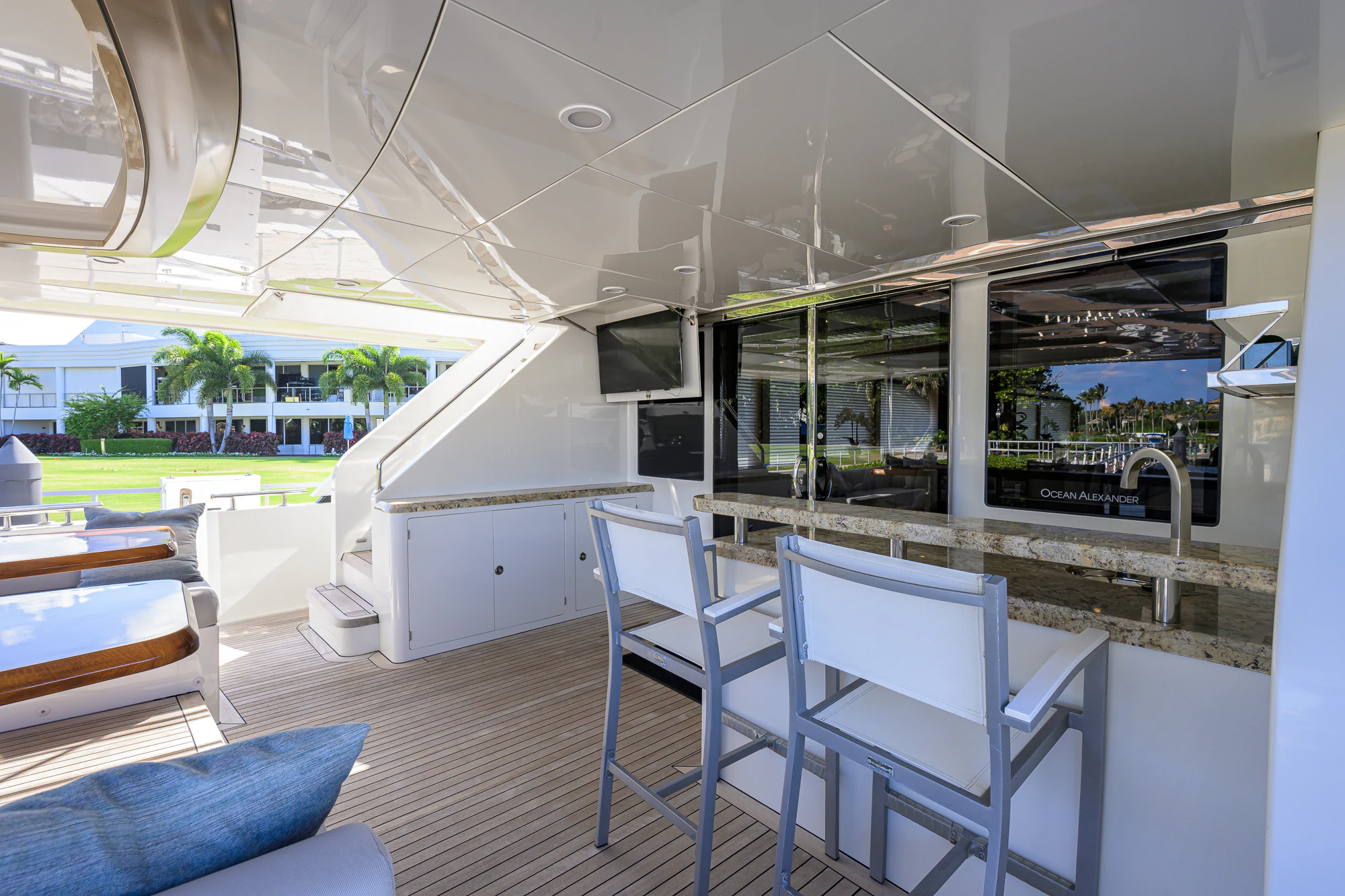 a room with a table chairs and a large window aboard CHINDON Yacht for Sale