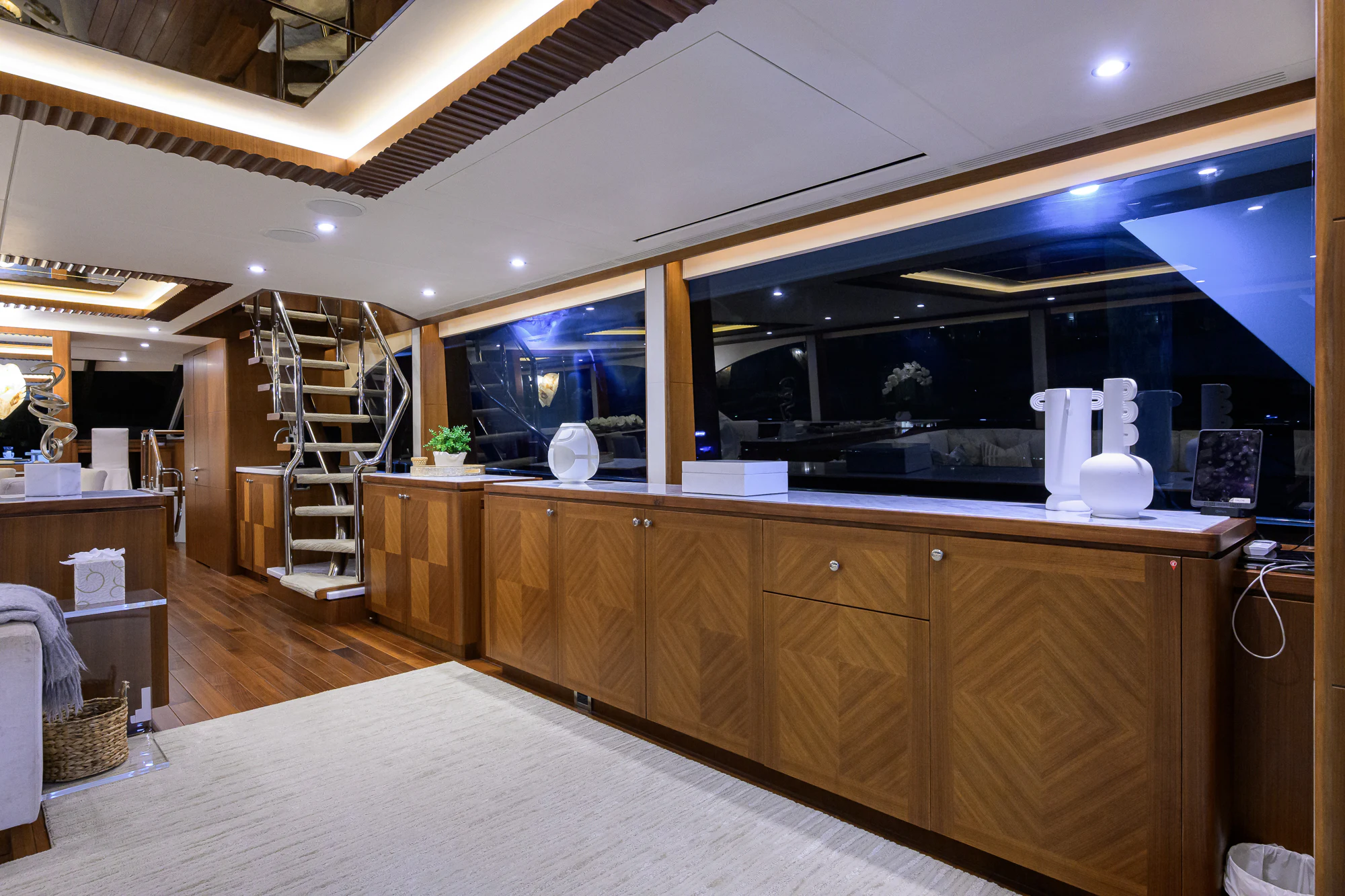 a room with a large counter and a staircase aboard CHINDON Yacht for Sale