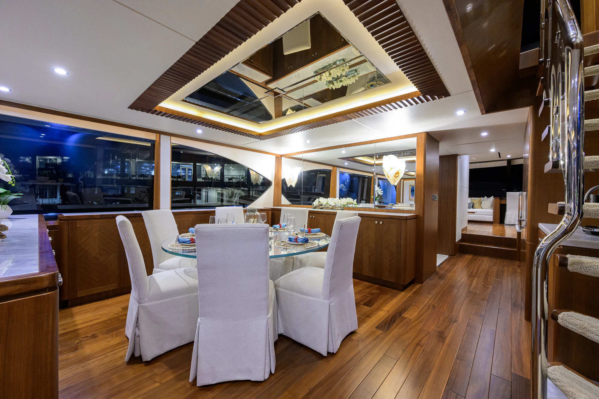a room with a table and chairs aboard CHINDON Yacht for Sale