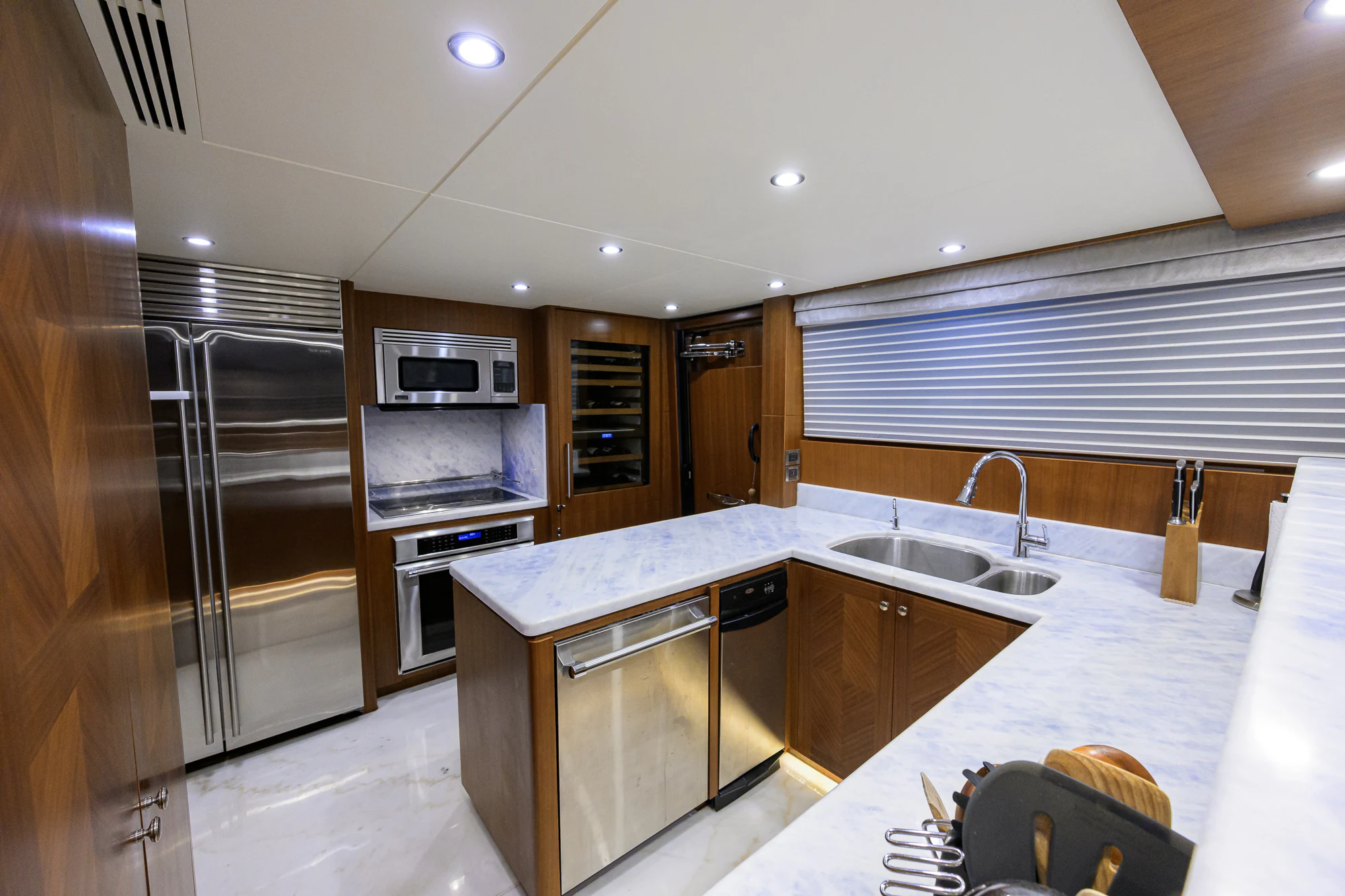 a kitchen with a large island aboard CHINDON Yacht for Sale