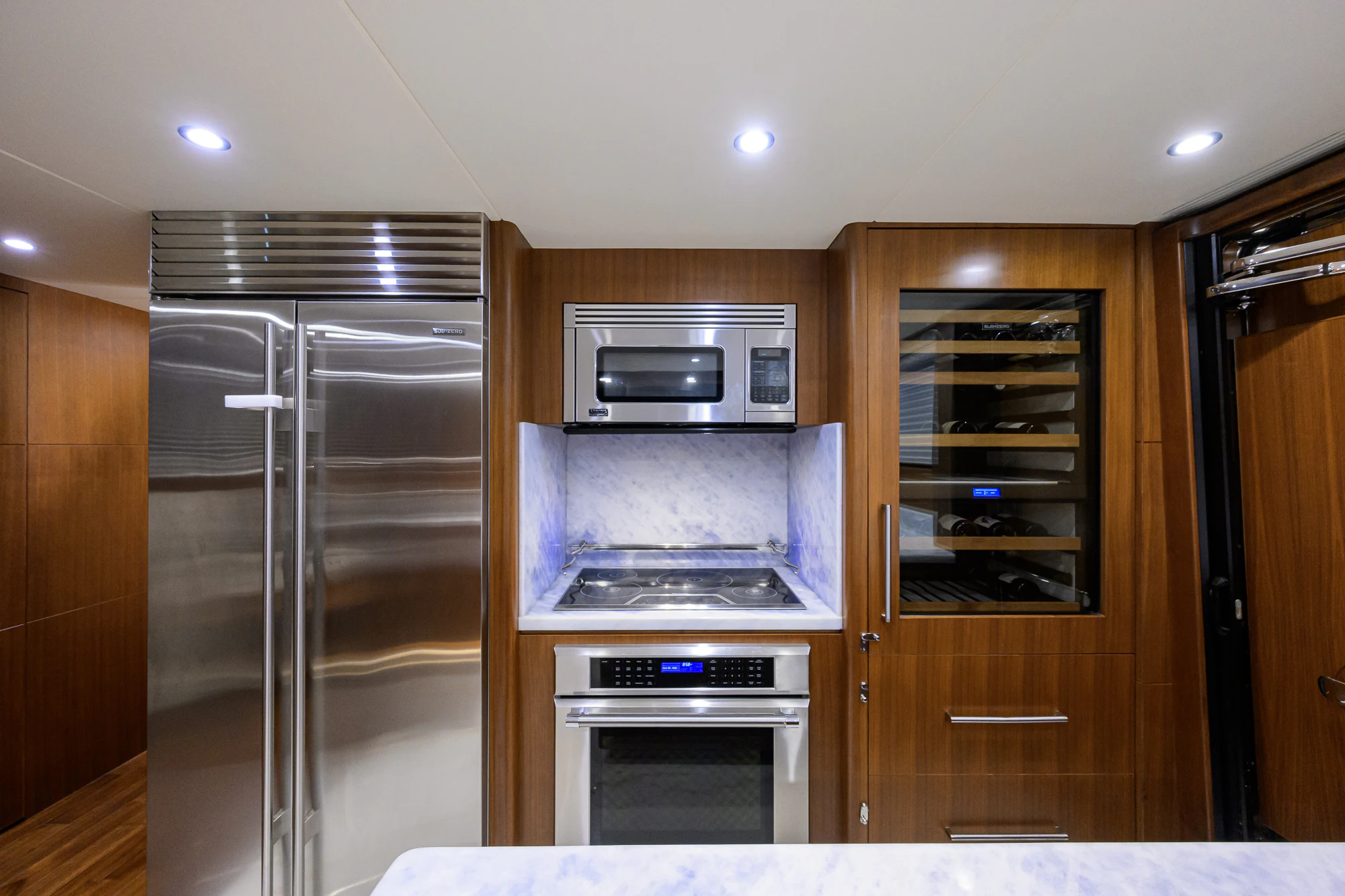a kitchen with stainless steel appliances aboard CHINDON Yacht for Sale