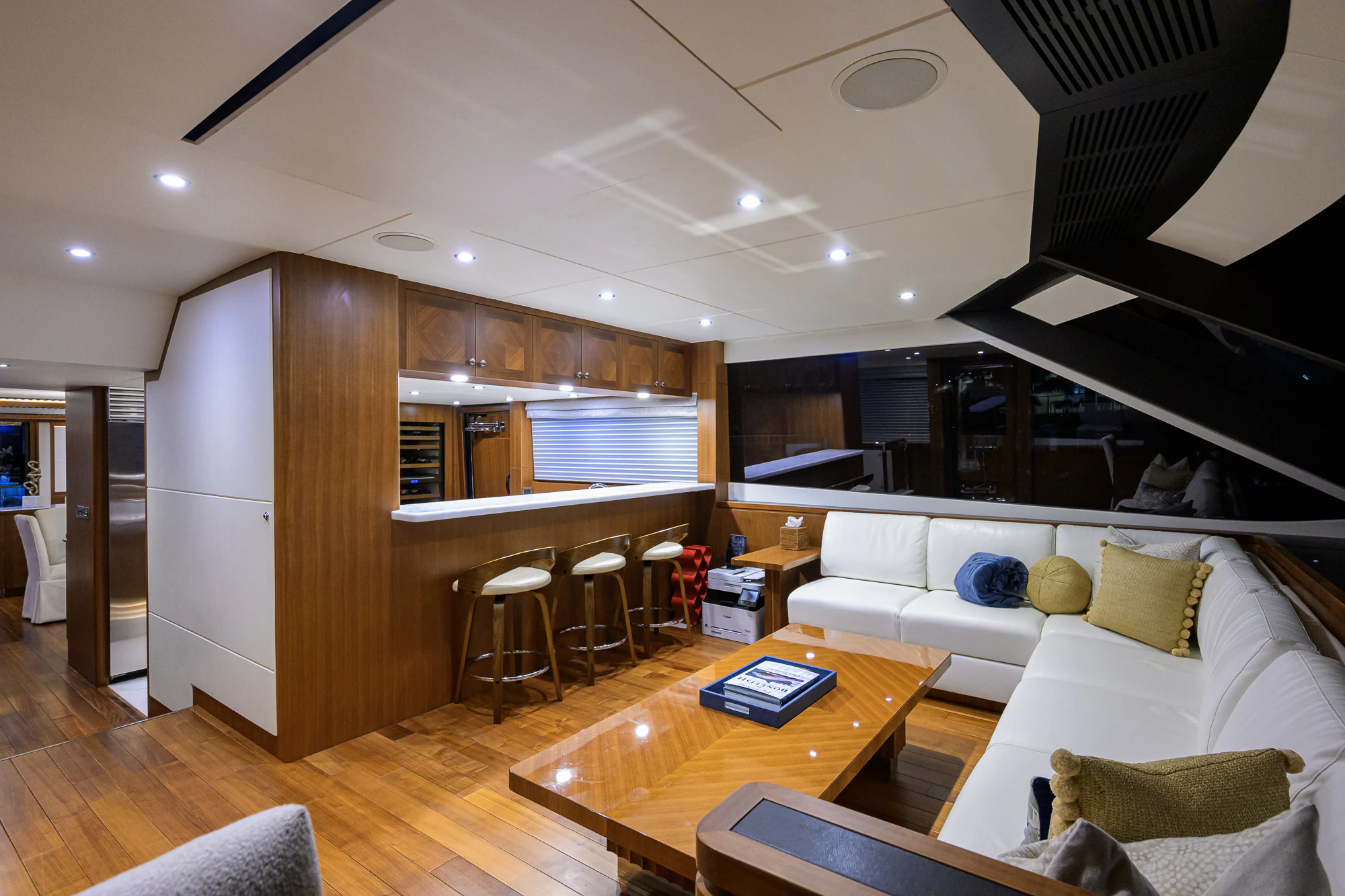 a living room with a wood floor aboard CHINDON Yacht for Sale