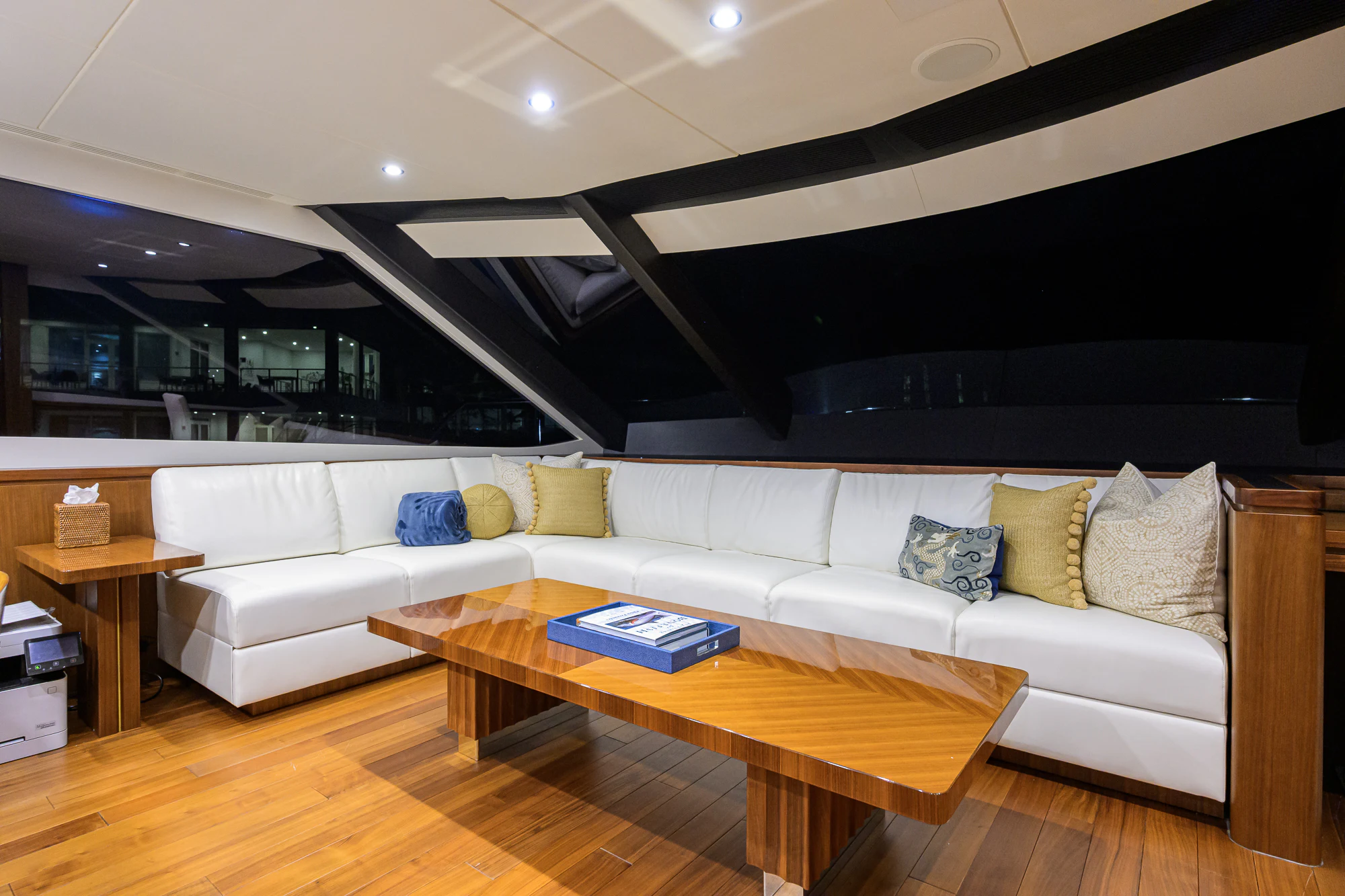 a living room with a couch and a coffee table aboard CHINDON Yacht for Sale