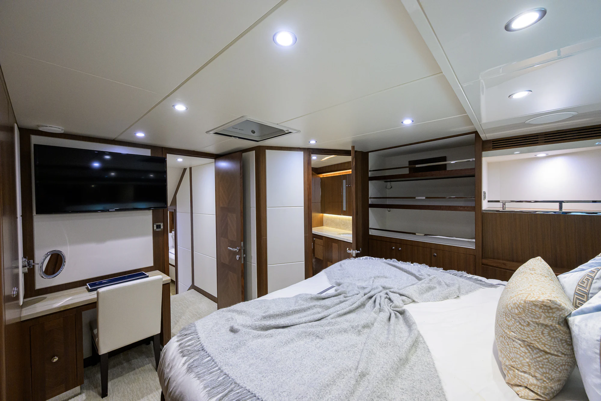 a bedroom with a bed and a television aboard CHINDON Yacht for Sale
