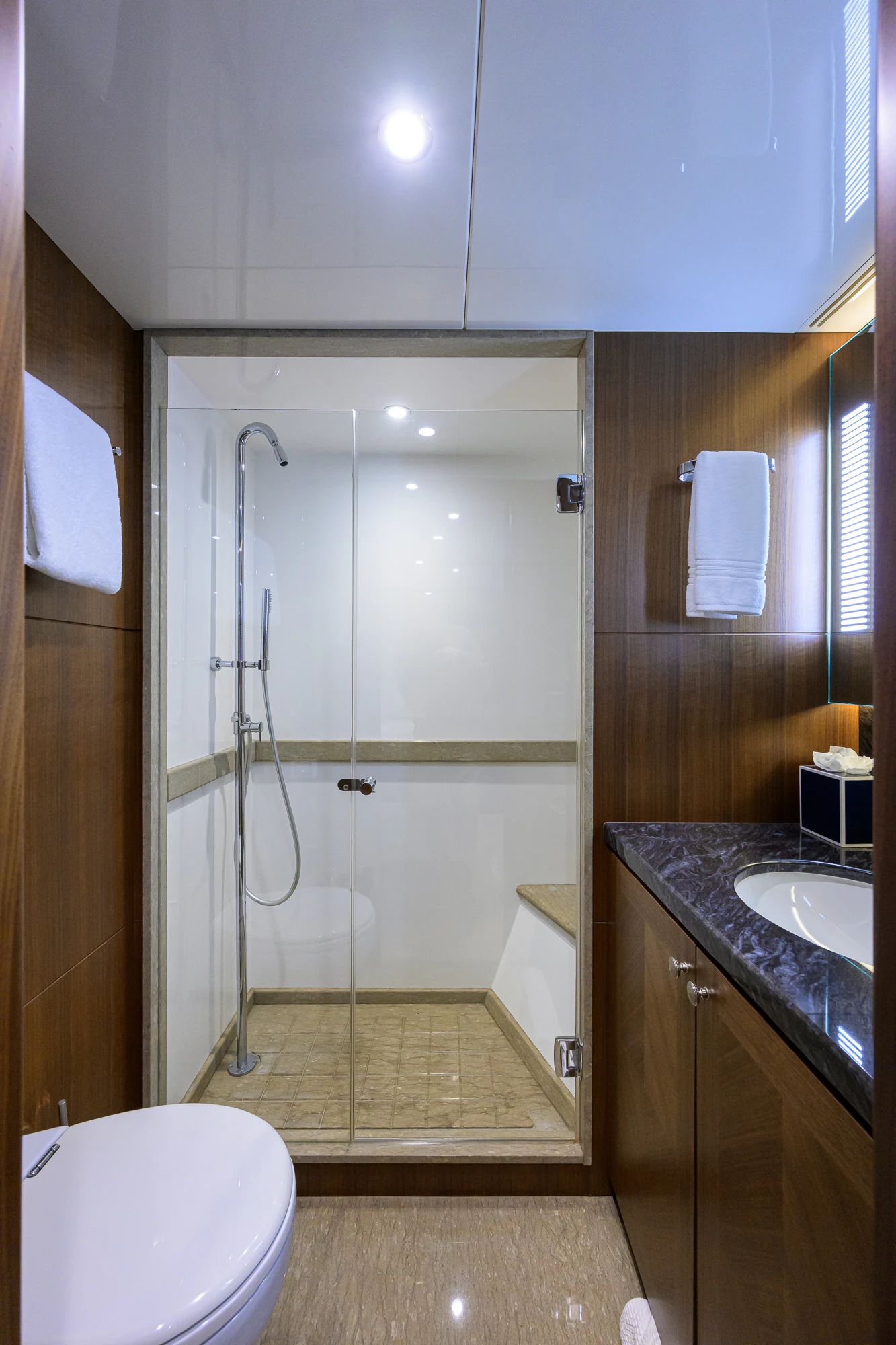 a bathroom with a shower unit and sink aboard CHINDON Yacht for Sale