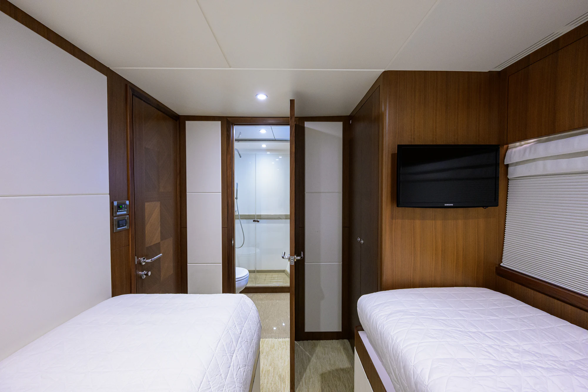 a room with a bed and a television aboard CHINDON Yacht for Sale