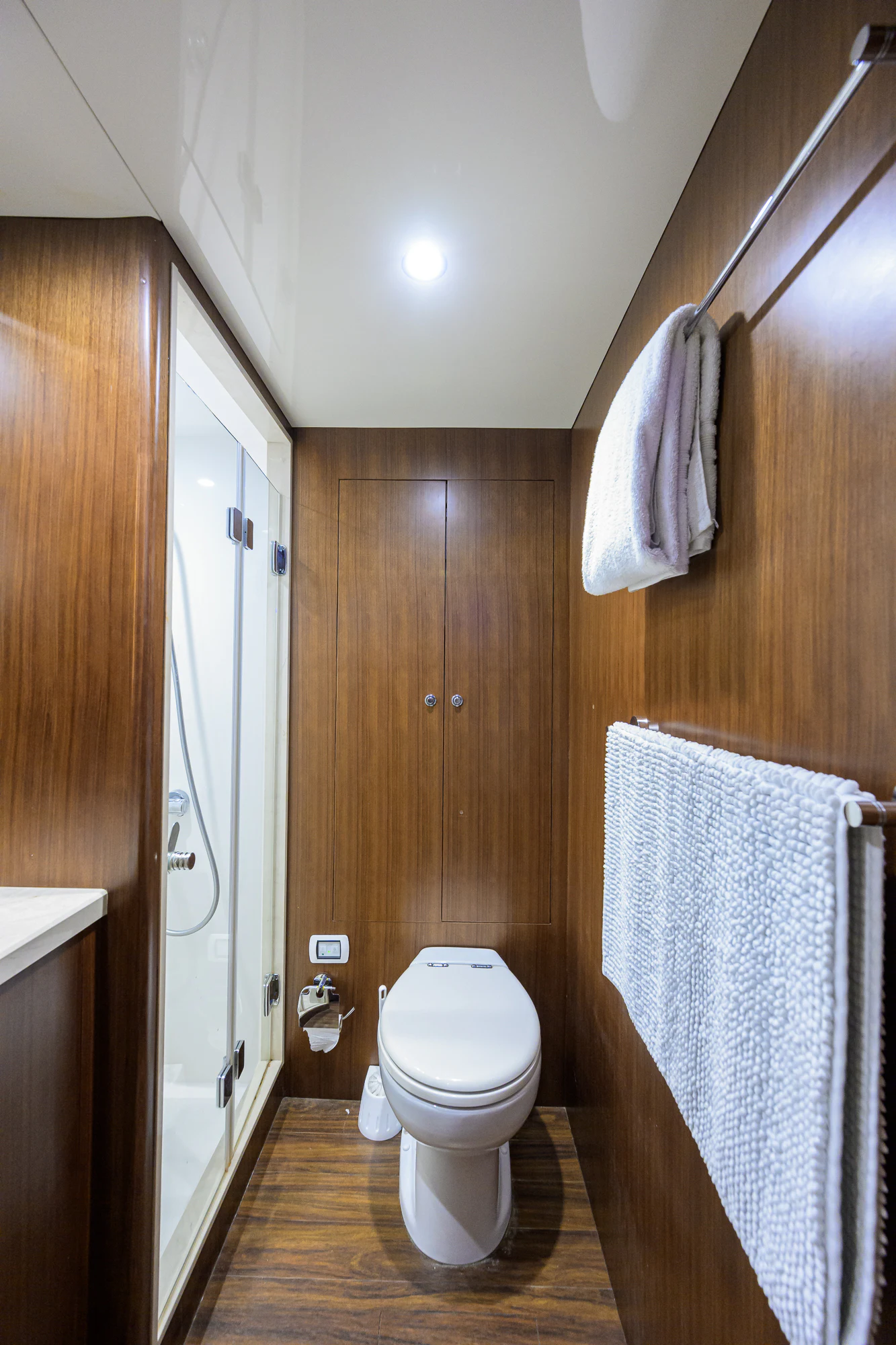 a bathroom with wooden walls aboard CHINDON Yacht for Sale