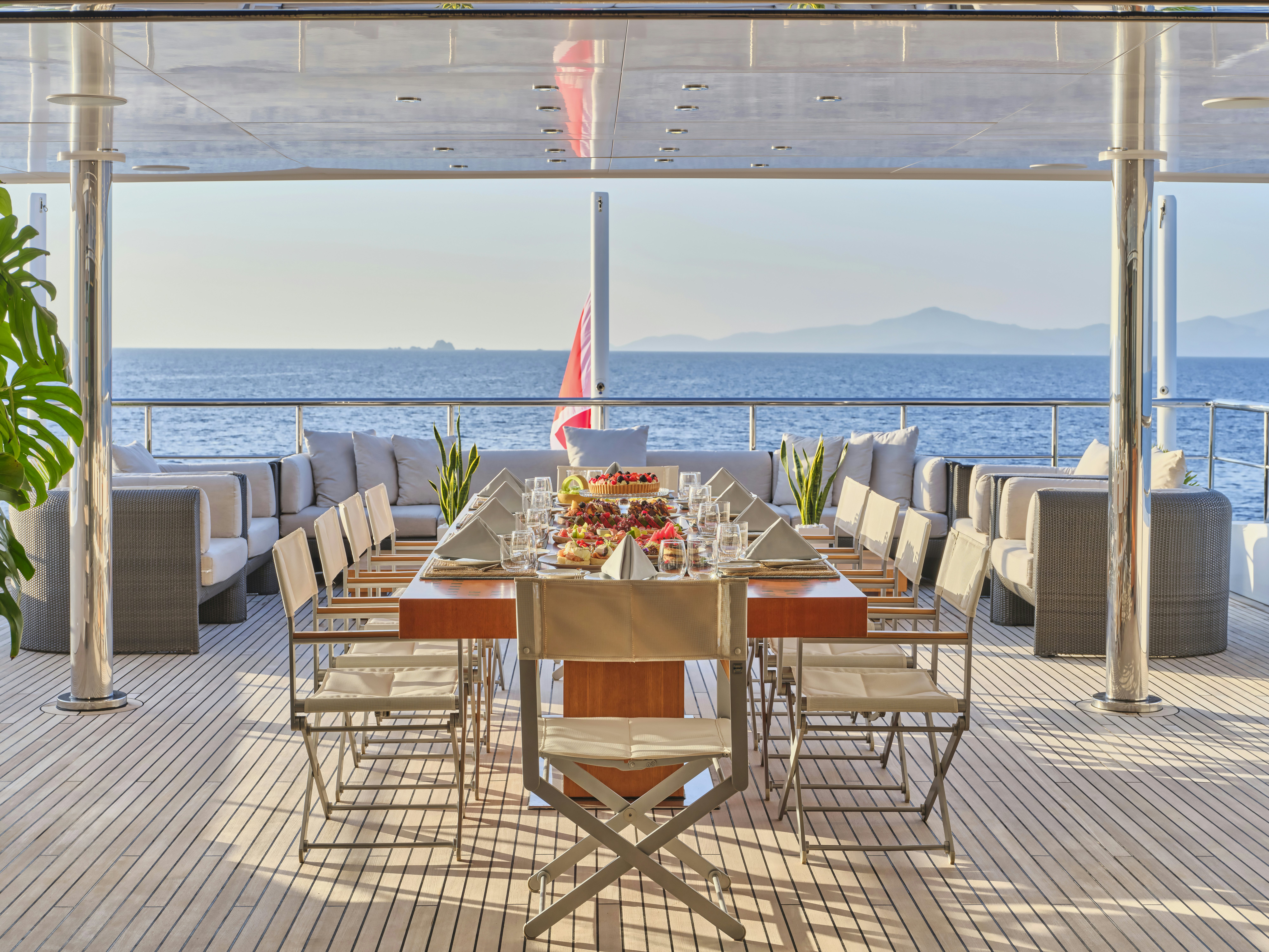 a table set for a dinner party aboard PERSEFONI I Yacht for Charter