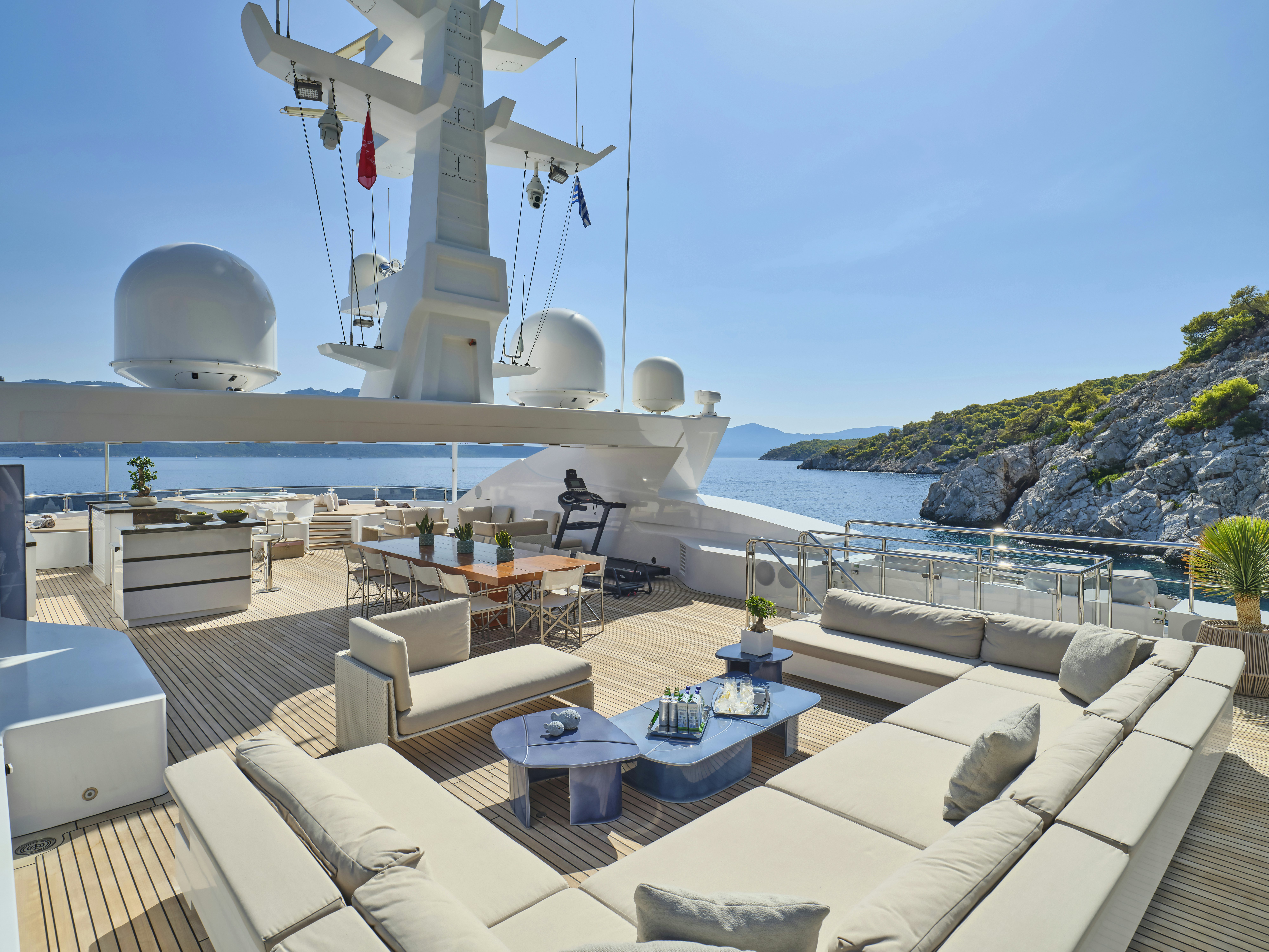 a deck with a large ship in the background aboard PERSEFONI I Yacht for Charter