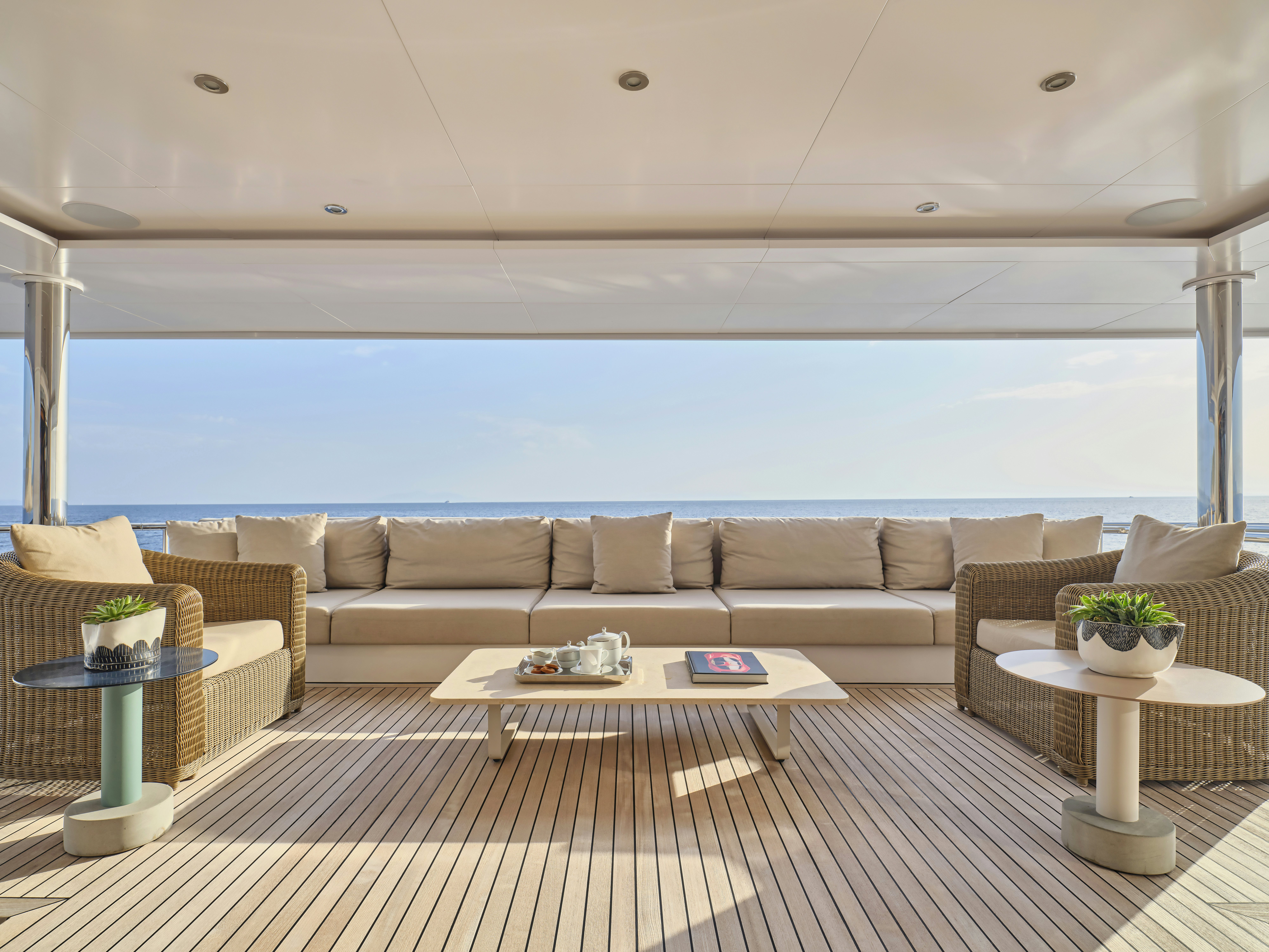 a living room with a couch and a table aboard PERSEFONI I Yacht for Charter
