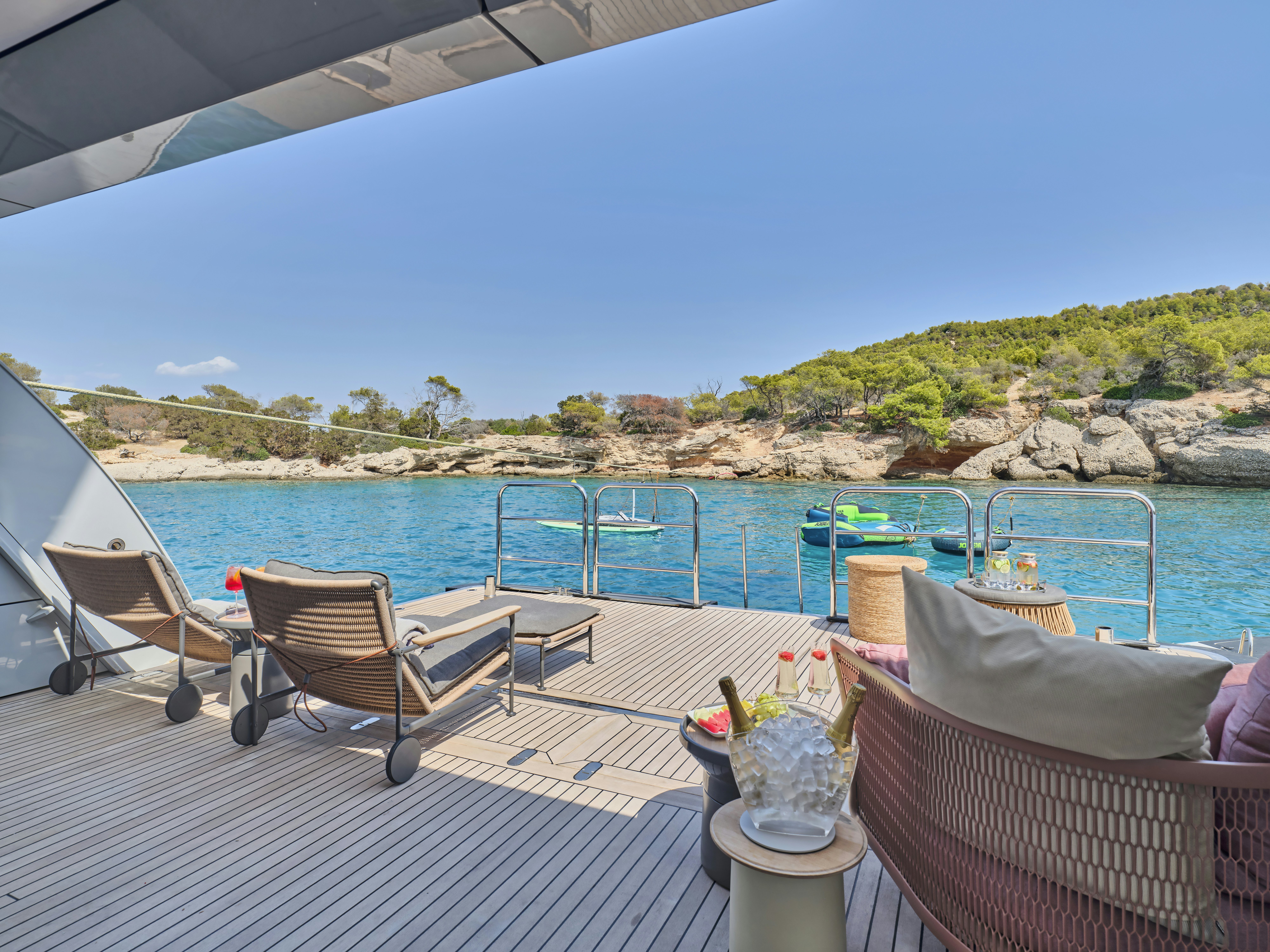 a deck with chairs and a pool aboard PERSEFONI I Yacht for Charter