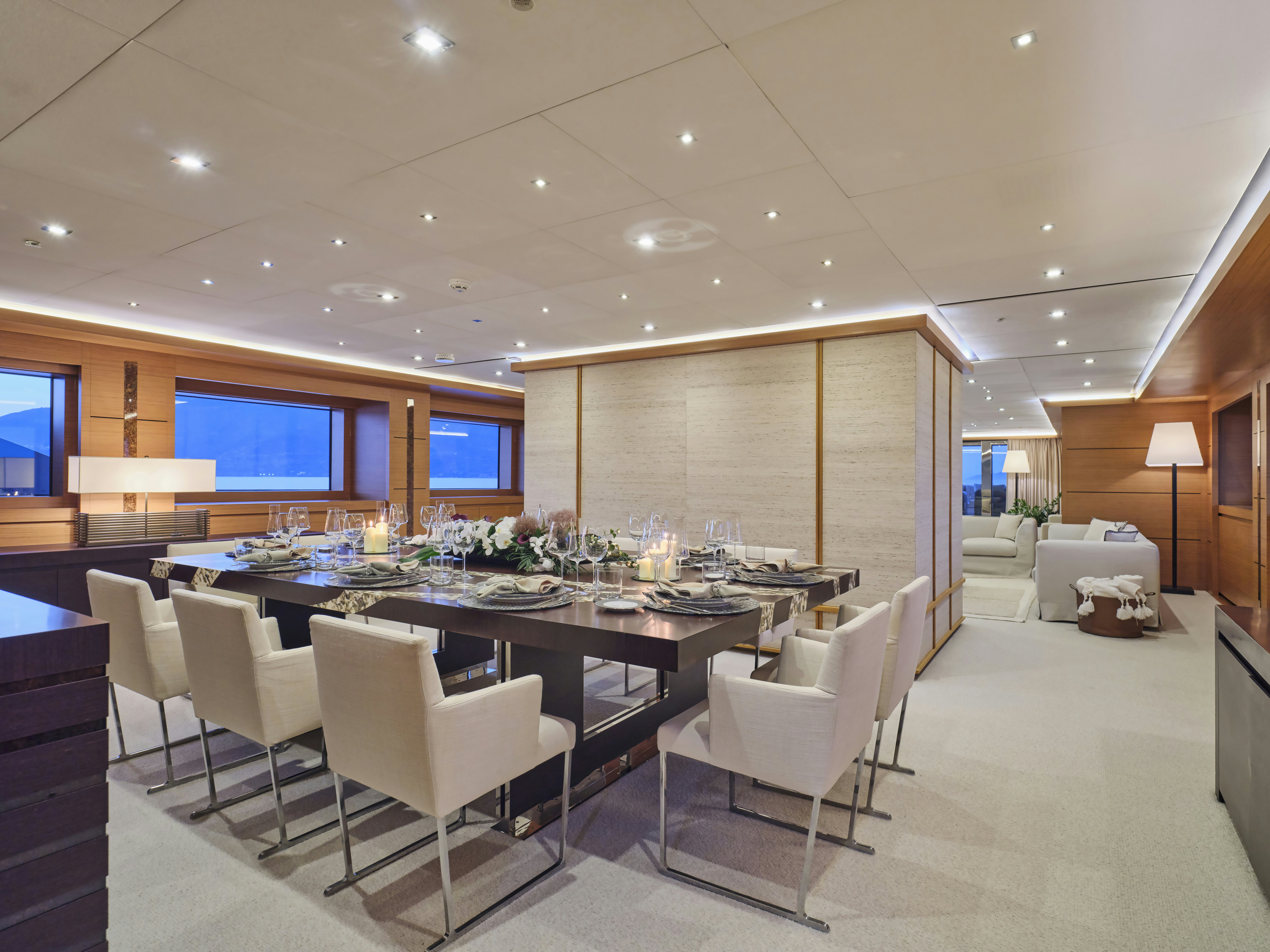 a large room with a table and chairs aboard PERSEFONI I Yacht for Charter