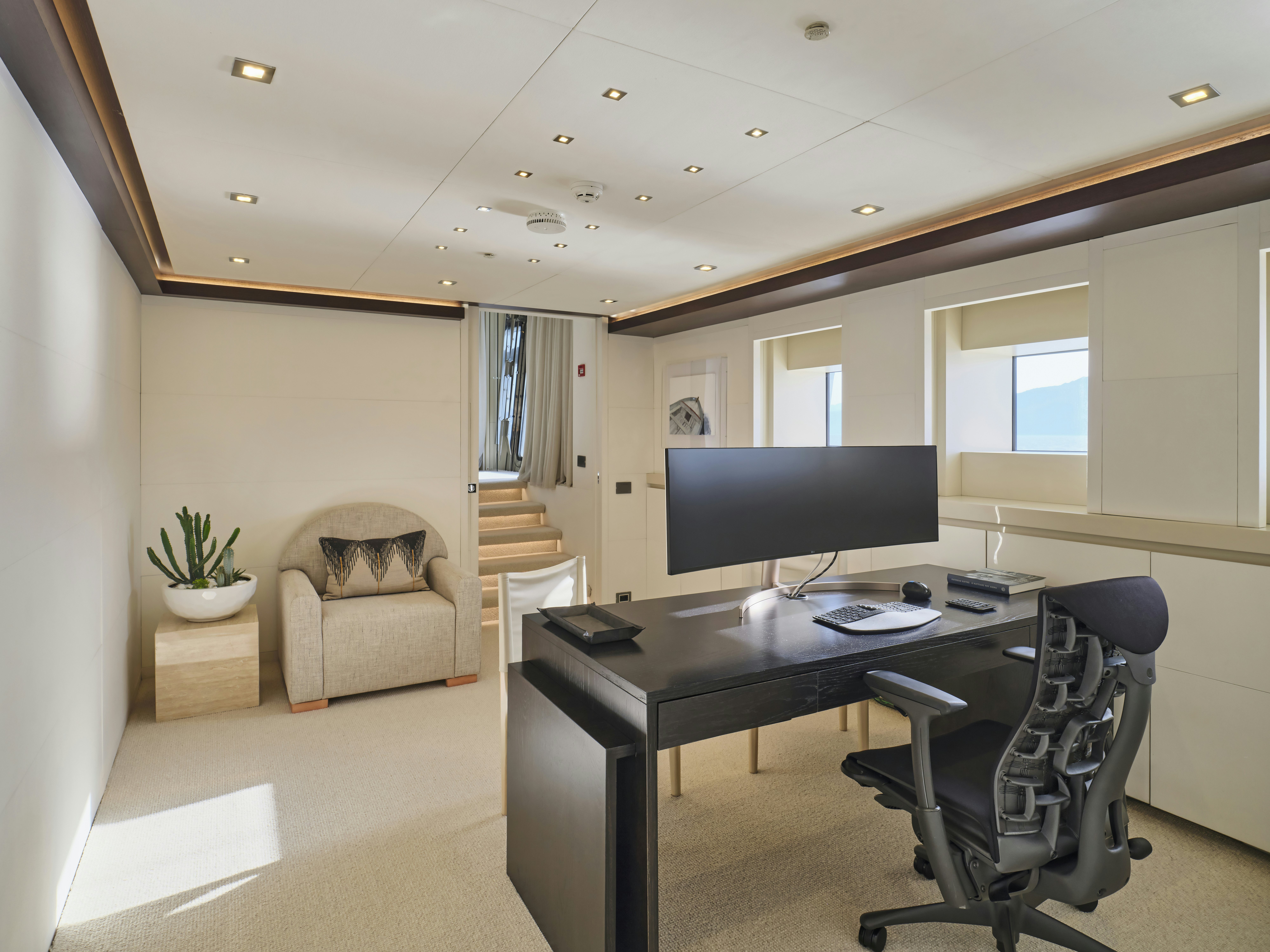 a room with a desk and a chair aboard PERSEFONI I Yacht for Charter